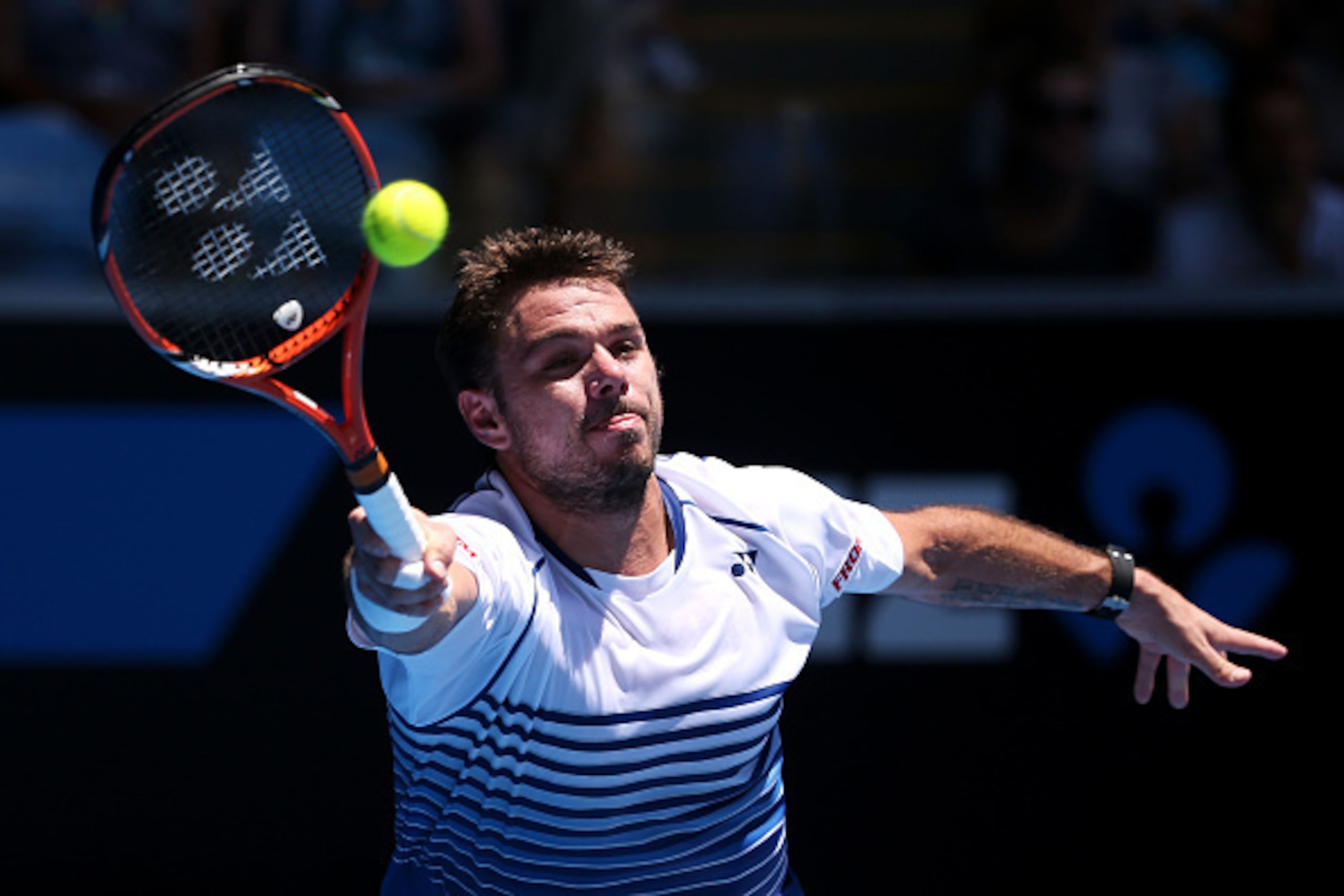 MELBOURNE, AUSTRALIA - JANUARY 22:  Stanislas Wawrinka of Switzerland plays a forehand in his second round match against Marius Copil of Romania during day four of the 2015 Australian Open at Melbourne Park on January 22, 2015 in Melbourne, Australia.  (P