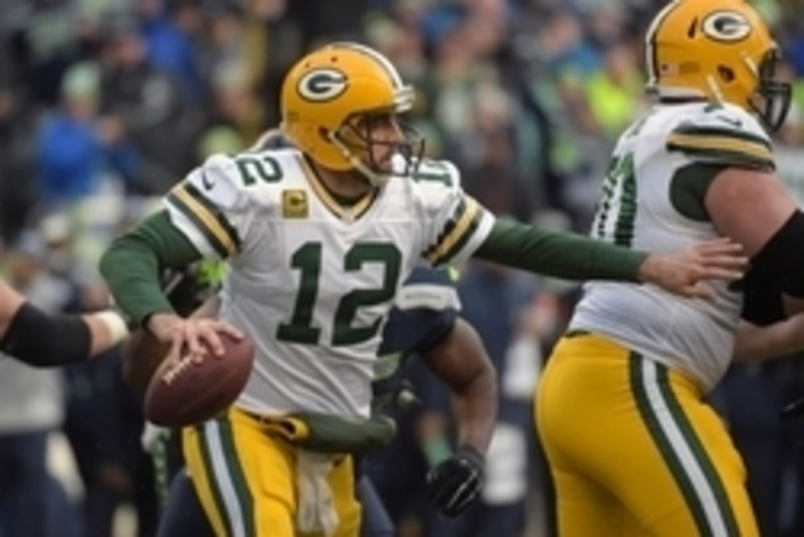Jan 18, 2015; Seattle, WA, USA; Green Bay Packers quarterback Aaron Rodgers (12) looks to throw the ball against the Seattle Seahawks during the fourth quarter in the NFC Championship Game at CenturyLink Field. Mandatory Credit: Kirby Lee-USA TODAY Sports