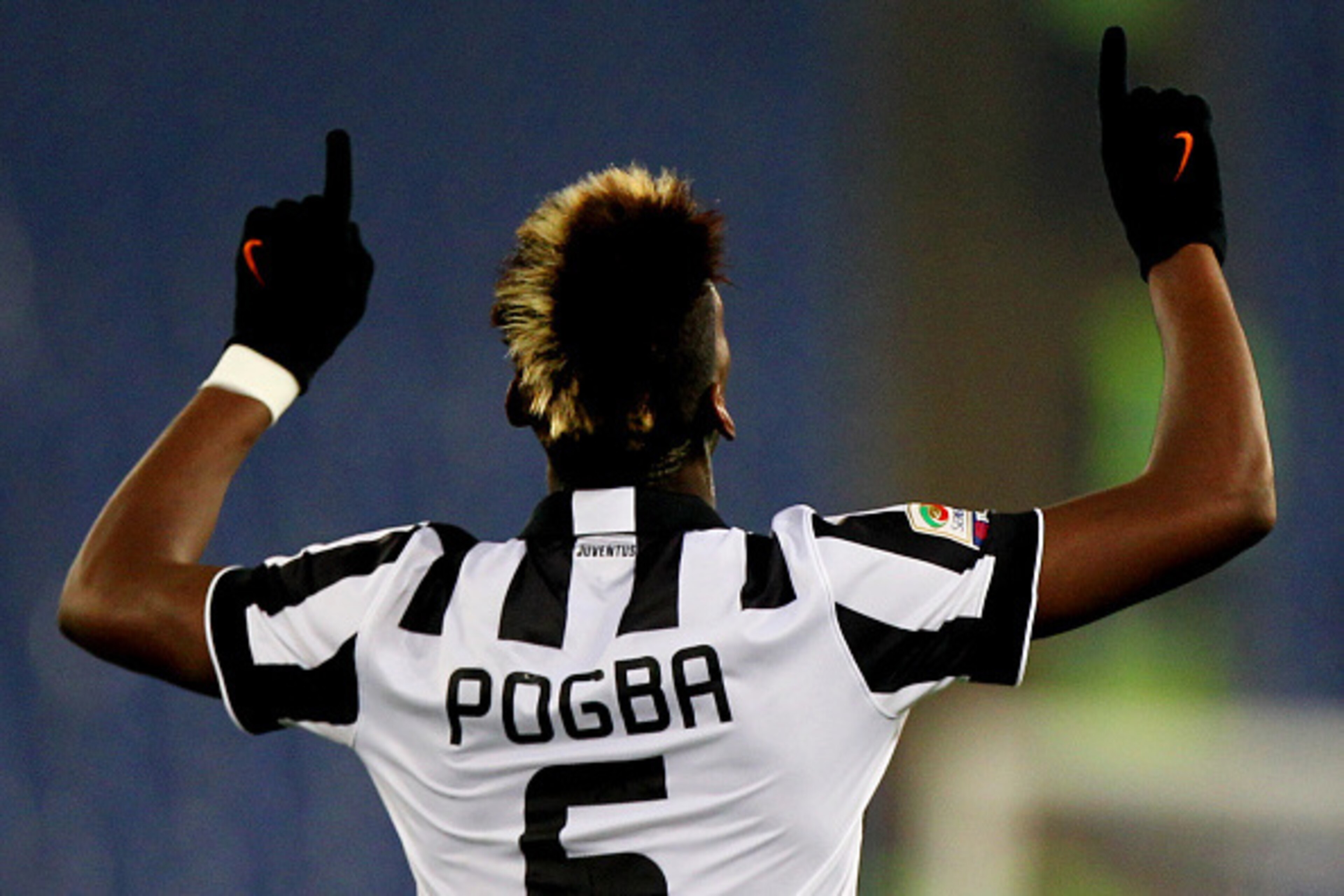 ROME, ITALY - NOVEMBER 22:  Paul Pogba of Juventus FC celebrates after scoring the opening goal during the Serie A match between SS Lazio and Juventus FC at Stadio Olimpico on November 22, 2014 in Rome, Italy.  (Photo by Paolo Bruno/Getty Images)