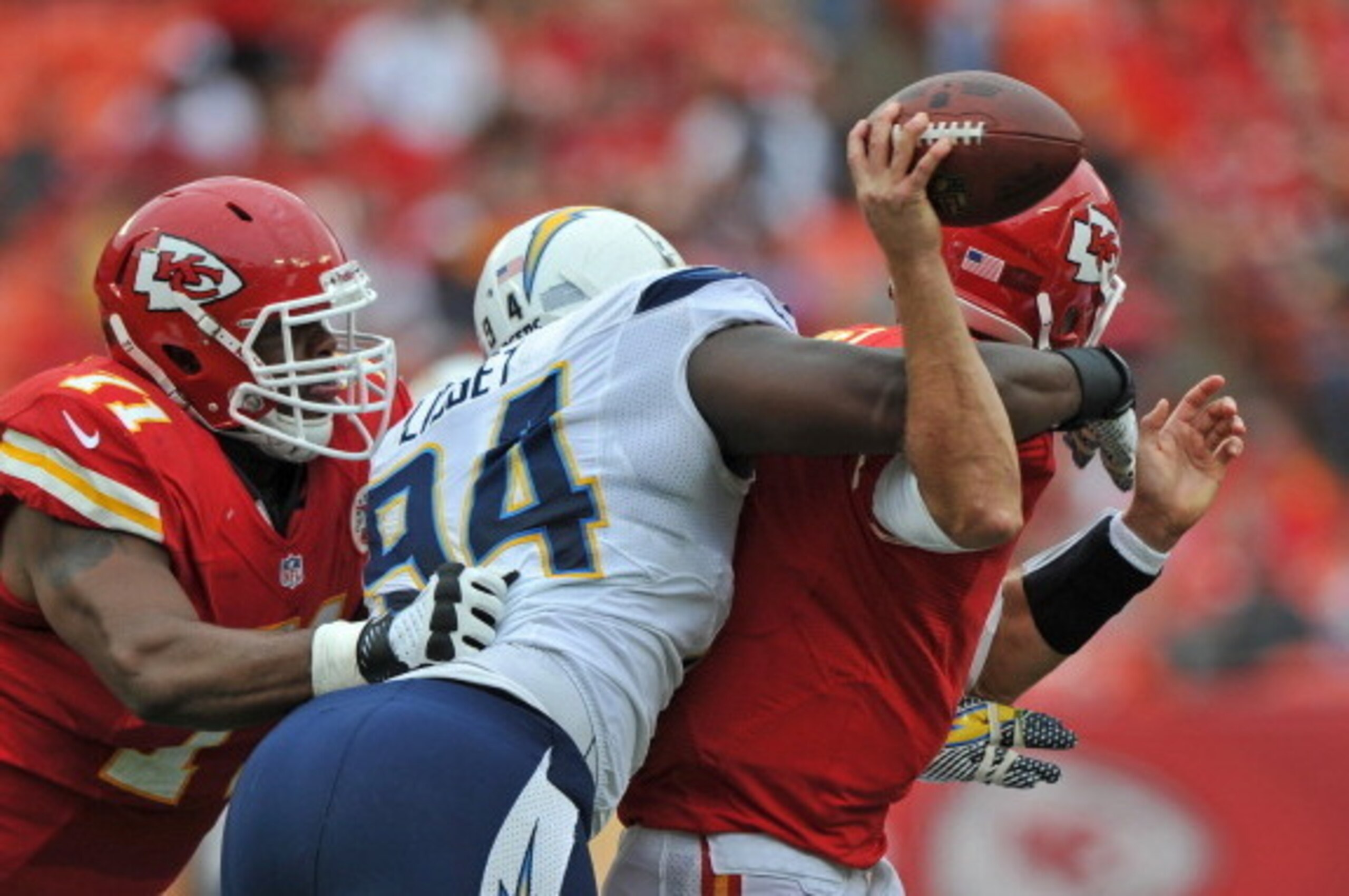 KANSAS CITY, MO - SEPTEMBER 30:  Defensive end Corey Liuget #94 of the San Diego Chargers hits quarterback Matt Cassel #7  of the Kansas City Chiefs from behind during the second quarter on September 30, 2012 at Arrowhead Stadium in Kansas City, Missouri.