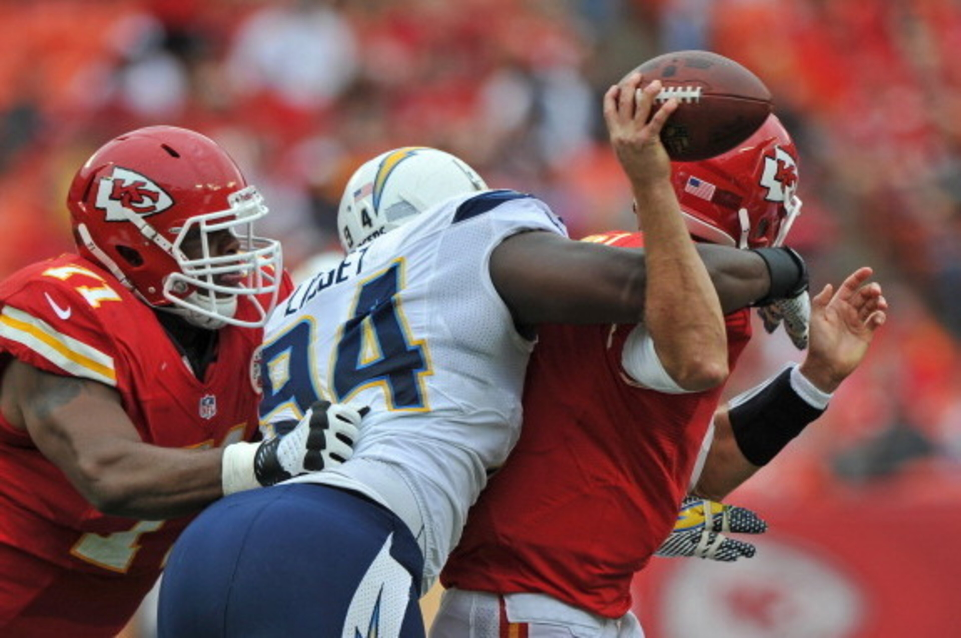 KANSAS CITY, MO - SEPTEMBER 30:  Defensive end Corey Liuget #94 of the San Diego Chargers hits quarterback Matt Cassel #7  of the Kansas City Chiefs from behind during the second quarter on September 30, 2012 at Arrowhead Stadium in Kansas City, Missouri.