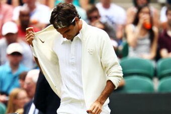 LONDON, ENGLAND - JUNE 30:  Roger Federer of Switzerland takes to the court before his quarter final match on Day Nine of the Wimbledon Lawn Tennis Championships at the All England Lawn Tennis and Croquet Club on June 30, 2010 in London, England.  (Photo 