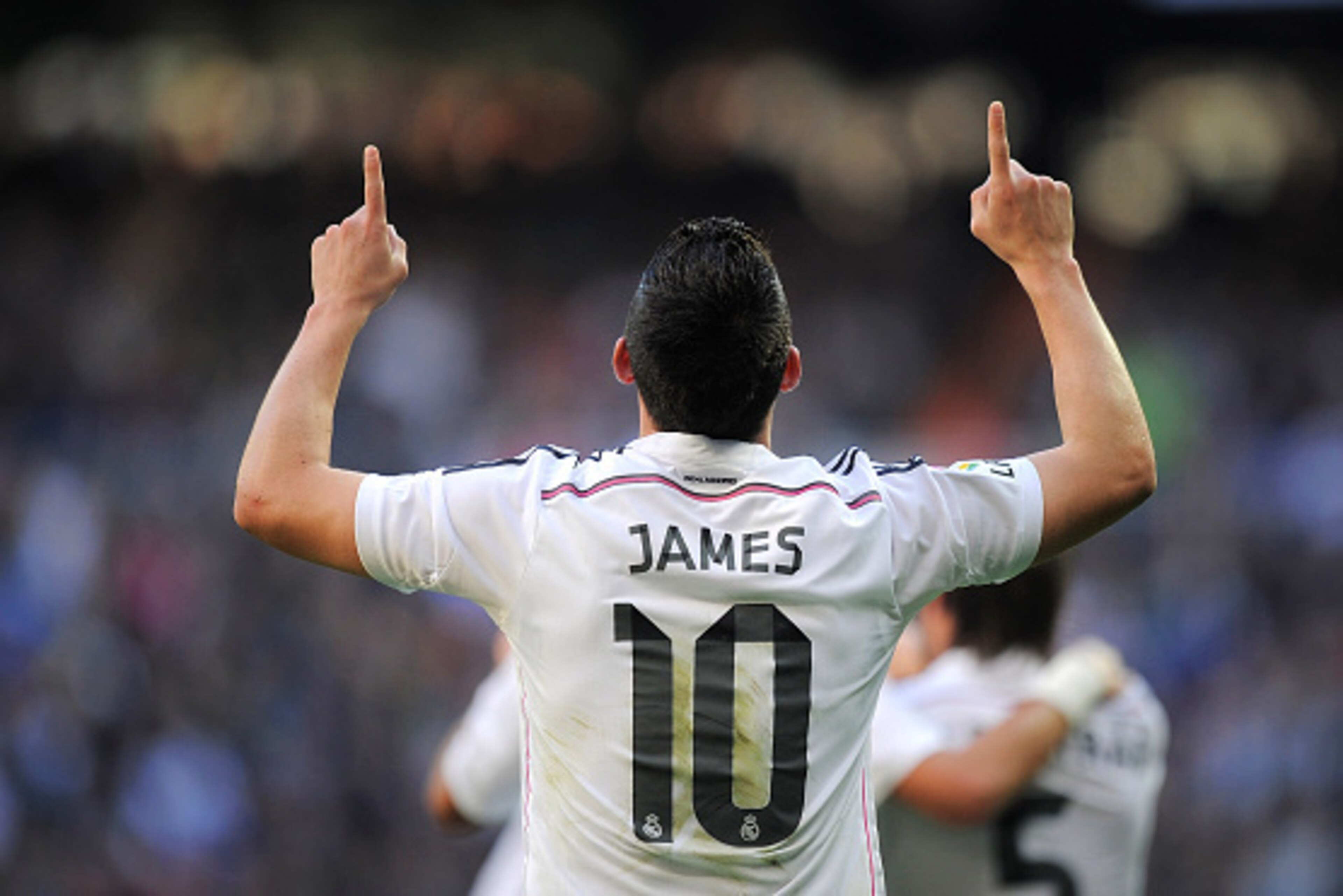 MADRID, SPAIN - JANUARY 10: James Rodriguez of Real Madrid celebrates after scoring Real's opening goal during the La Liga match between Real Madrid CF and RCD Espanyol at Estadio Santiago Bernabeu on January 10, 2015 in Madrid, Spain.  (Photo by Denis Do