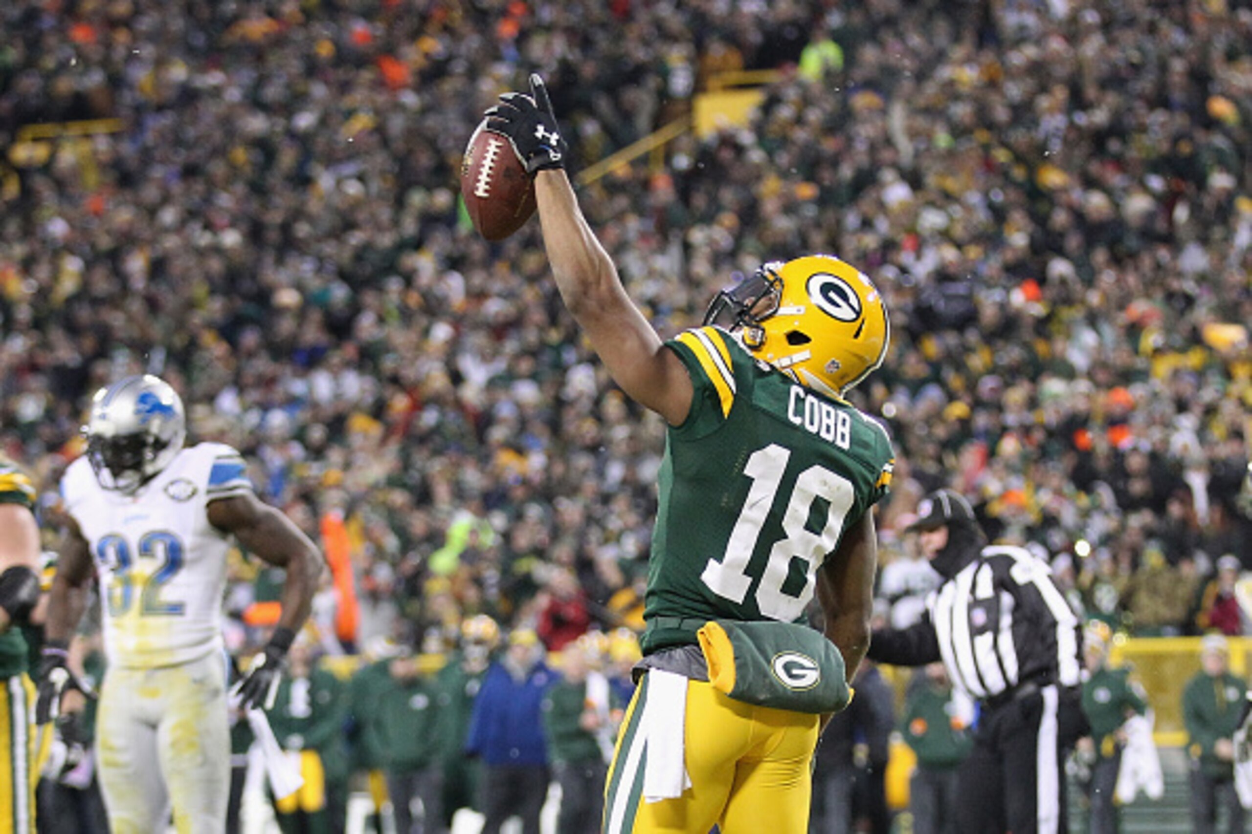 GREEN BAY, WI - DECEMBER 28:  Wide receiver Randall Cobb #18 of the Green Bay Packers reacts after scoring a touchdown in the second quarter against the Detroit Lions during the NFL game at Lambeau Field on December 28, 2014 in Green Bay, Wisconsin.  (Pho