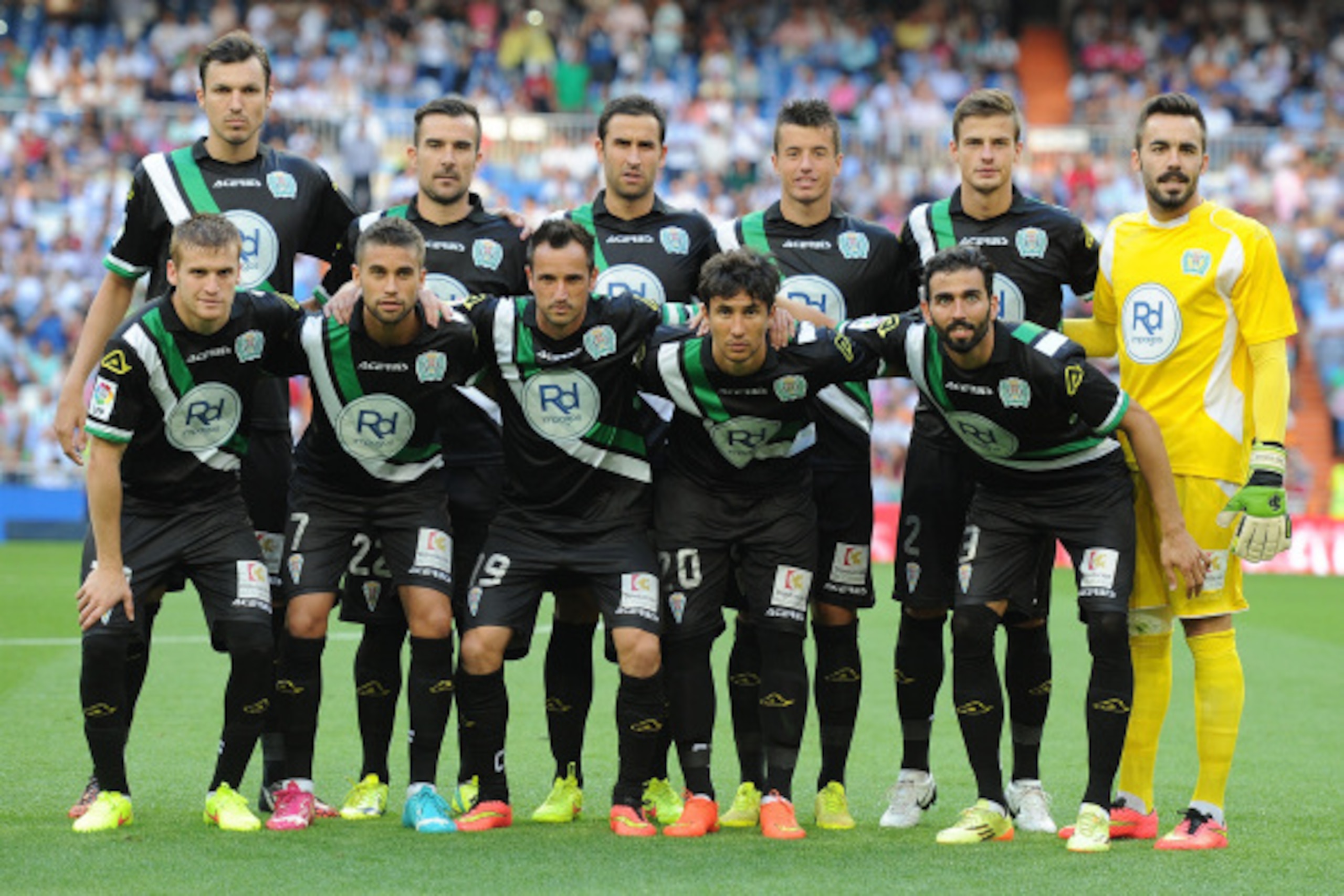 MADRID, SPAIN - AUGUST 25:  The Crodoba CF tem line up before the start  of the La liga match between Real Madrid CF and Cordoba CF at Estadio Santiago Bernabeu on August 25, 2014 in Madrid, Spain.  (Photo by Denis Doyle/Getty Images)