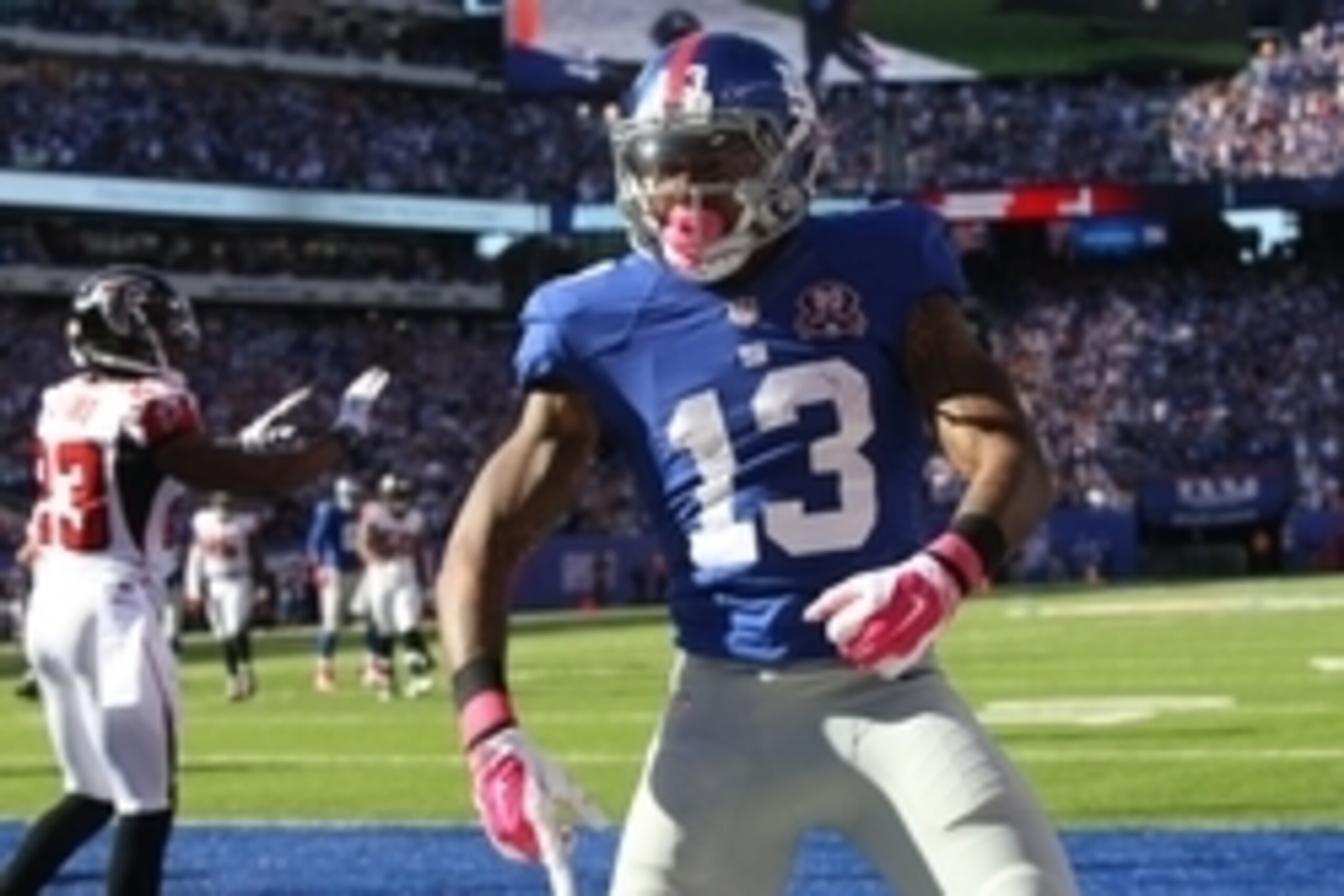 Oct 5, 2014; East Rutherford, NJ, USA; New York Giants wide receiver Odell Beckham (13) reacts after a touchdown against the Atlanta Falcons during the second half at MetLife Stadium. The New York Giants defeated the Atlanta Falcons 30-20.Mandatory Credit