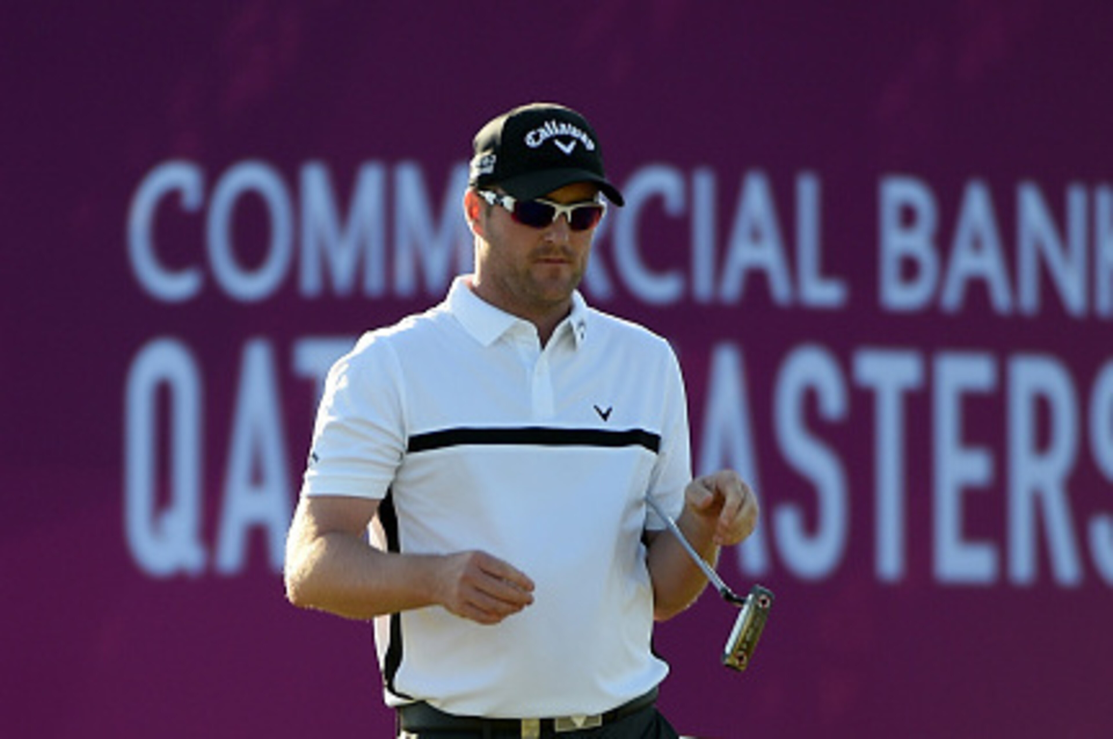 DOHA, QATAR - JANUARY 22:  Marc Warren of Scotland in action during the second round of the Commercial Bank Qatar Masters at the Doha Golf Club on January 22, 2015 in Doha, Qatar.  (Photo by Ross Kinnaird/Getty Images)