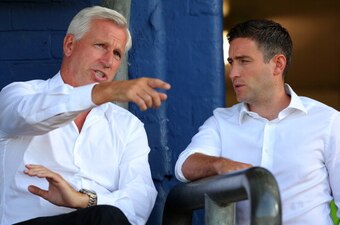 OLDHAM, ENGLAND - JULY 15: Alan Pardew, manager of Newcastle United, talks to Oldham Athletic manager Lee Johnson (R) during the pre season friendly at SportsDirect.com Park on July 15, 2014 in Oldham, England.  (Photo by Dave Thompson/Getty Images)