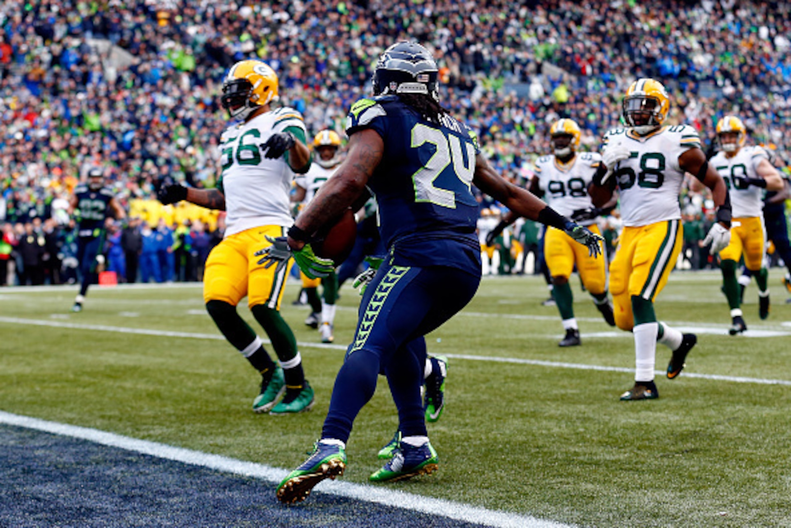 SEATTLE, WA - JANUARY 18: Marshawn Lynch #24 of the Seattle Seahawks runs the ball in for a touchdown during the fourth quarter of the 2015 NFC Championship game against the Green Bay Packers at CenturyLink Field on January 18, 2015 in Seattle, Washington SEATTLE, WA - JANUARY 18: Marshawn Lynch #24 of the Seattle Seahawks runs the ball in for a touchdown during the fourth quarter of the 2015 NFC Championship game against the Green Bay Packers at CenturyLink Field on January 18, 2015 in Seattle, Washington
