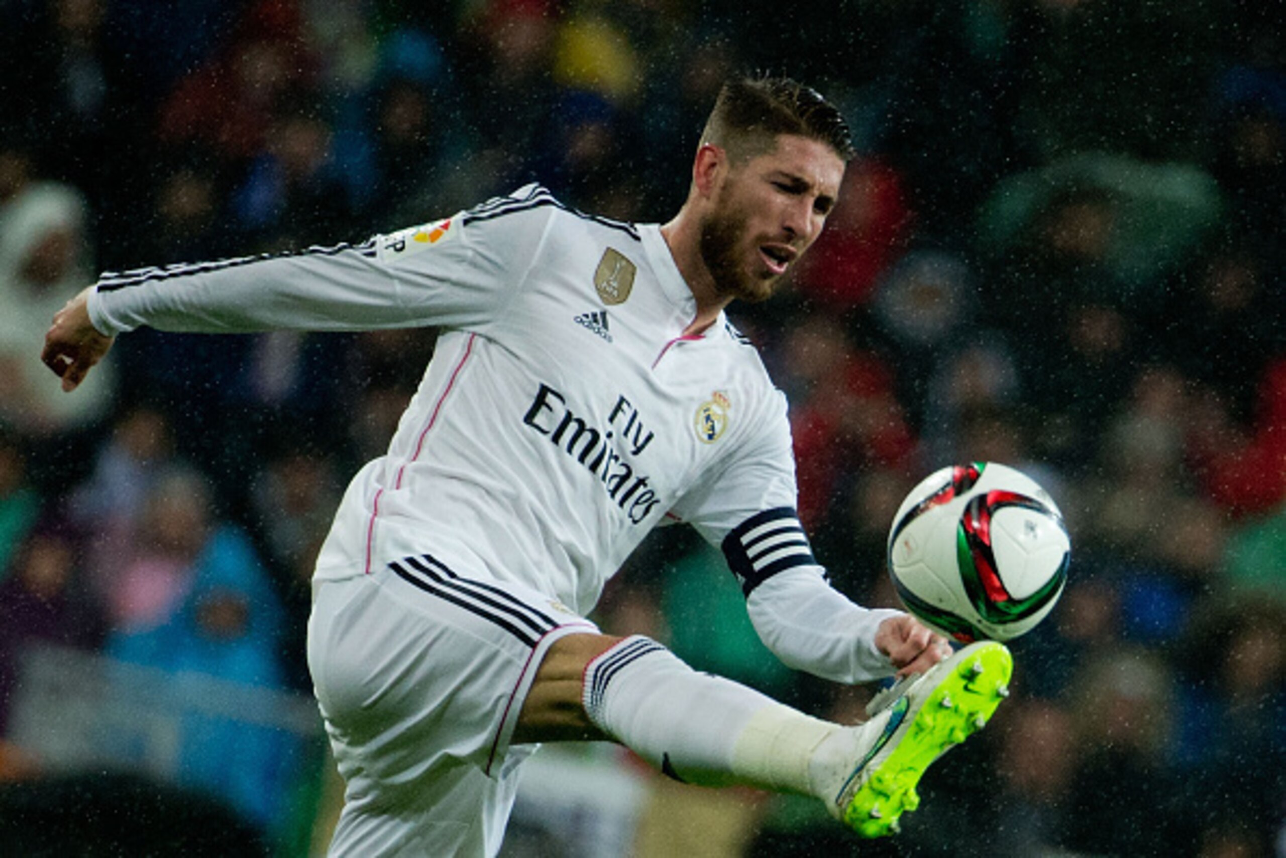 MADRID, SPAIN - JANUARY 15: Sergio Ramos of Real Madrid CF strikes the ball during the Copa del Rey Round of 16  second leg match between Real Madrid CF and Club Atletico de Madrid at Estadio Santiago Bernabeu on January 15, 2015 in Madrid, Spain.  (Photo