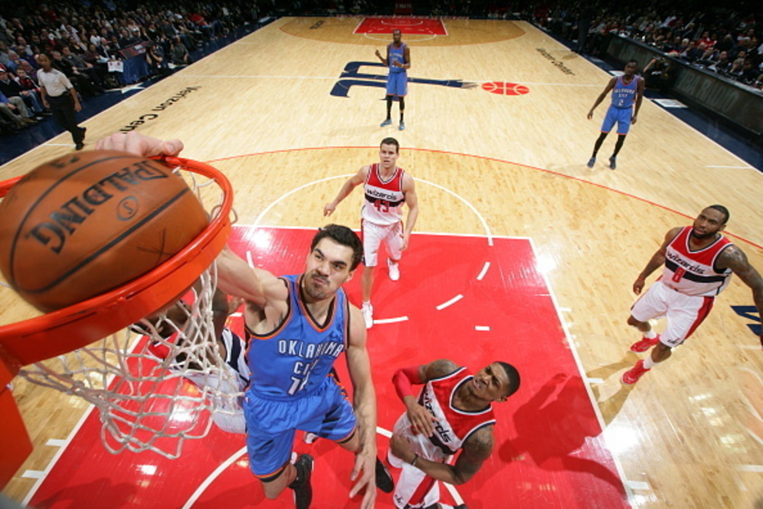 WASHINGTON, DC -  JANUARY 21: Steven Adams #12 of the Oklahoma City Thunder dunks against the Washington Wizards on January 21, 2015 at Verizon Center in Washington, DC. NOTE TO USER: User expressly acknowledges and agrees that, by downloading and or usin