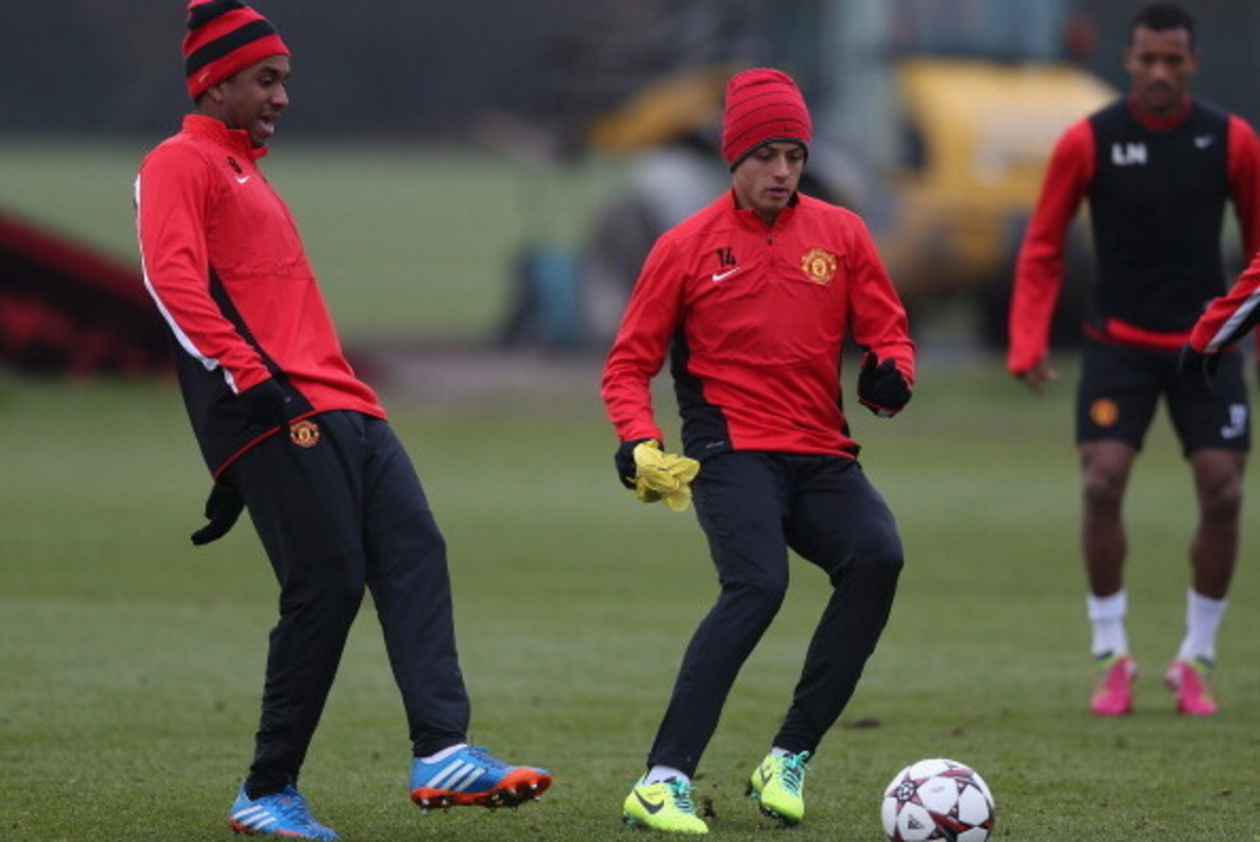 MANCHESTER, ENGLAND - NOVEMBER 26: Anderson of Manchester United in action with team mate Javier Hernandez during a first team training session ahead of their UEFA Champions League match against Bayer Leverkusen at the Aon Training Complex at Carrington o MANCHESTER, ENGLAND - NOVEMBER 26: Anderson of Manchester United in action with team mate Javier Hernandez during a first team training session ahead of their UEFA Champions League match against Bayer Leverkusen at the Aon Training Complex at Carrington o