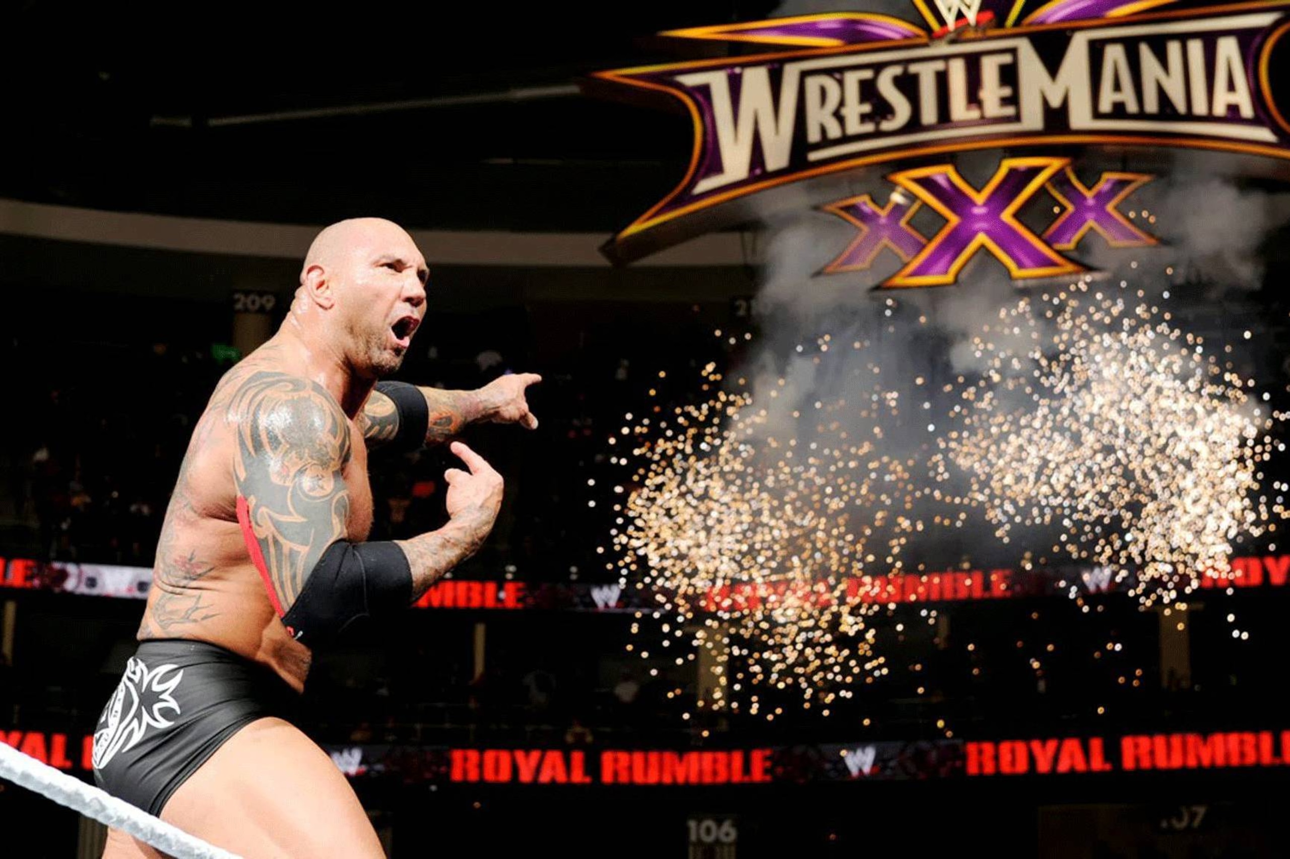 Batista celebrates his Royal Rumble win.