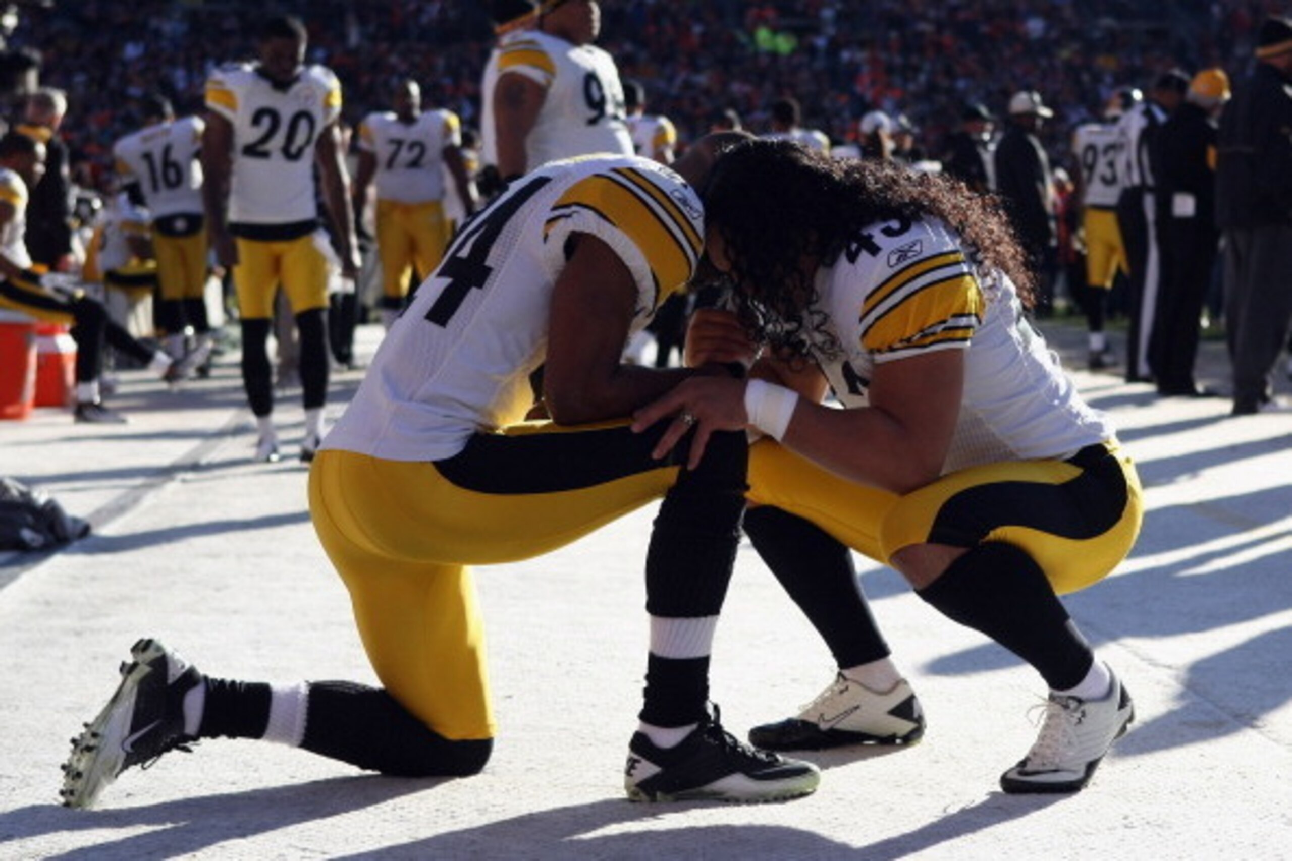 DENVER, CO - JANUARY 08:  Ike Taylor (L) #24 and Troy Polamalu #43 of the Pittsburgh Steelers pray together prior turnover the start of the AFC Wild Card Playoff game against the Denver Broncos at Sports Authority Field at Mile High on January 8, 2012 in 