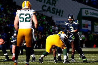 SEATTLE, WA - JANUARY 18: Russell Wilson #3 of the Seattle Seahawks calls out a play at the line of scrimmage as  Clay Matthews #52 of the Green Bay Packers waits on defense during the first half of the 2015 NFC Championship game at CenturyLink Field on J