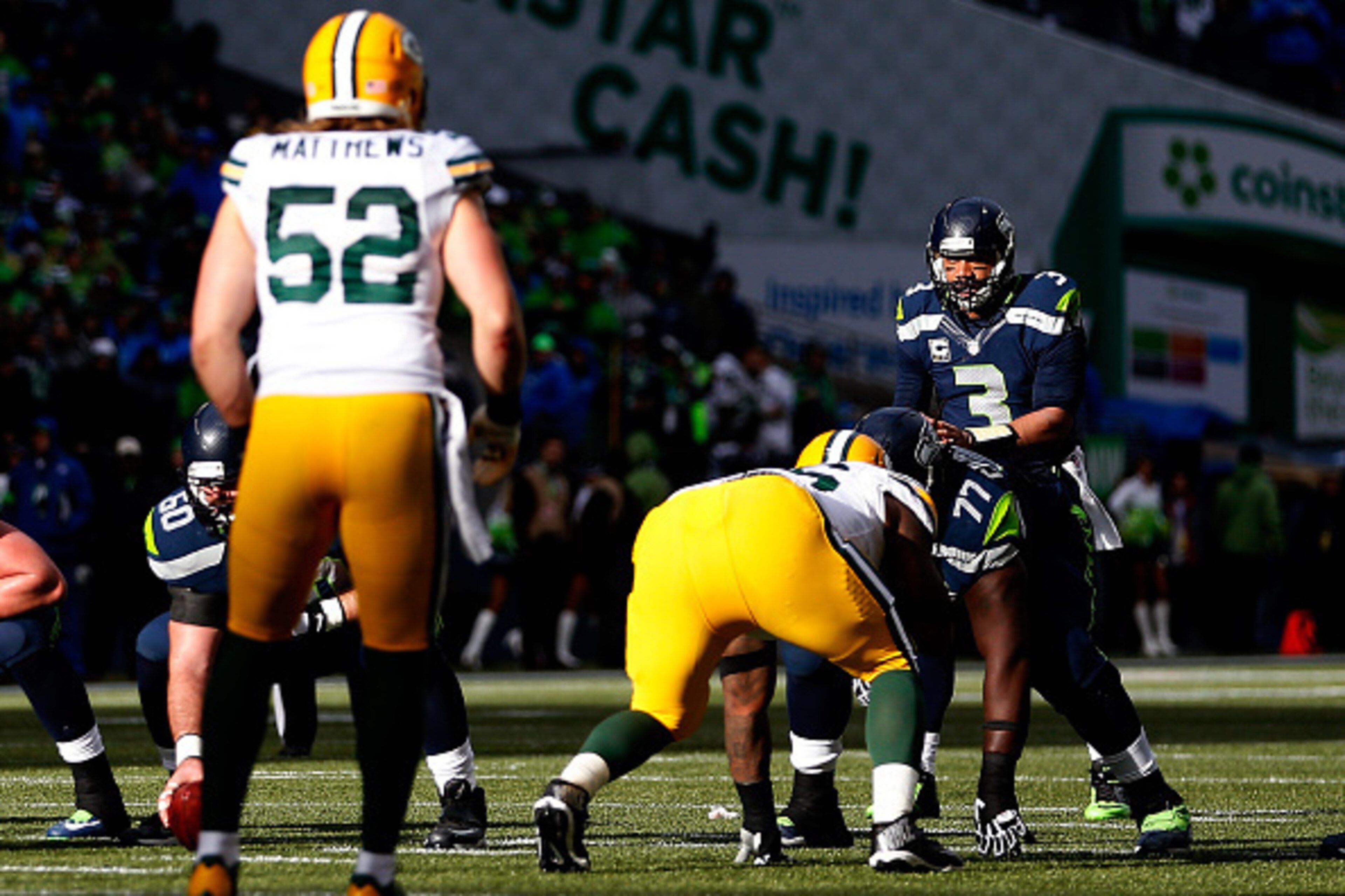 SEATTLE, WA - JANUARY 18: Russell Wilson #3 of the Seattle Seahawks calls out a play at the line of scrimmage as  Clay Matthews #52 of the Green Bay Packers waits on defense during the first half of the 2015 NFC Championship game at CenturyLink Field on J