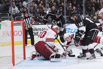 LOS ANGELES, CA - DECEMBER 20: Devan Dubnyk #40 of the Arizona Coyotes attempts a save as Connor Murphy #5 of the Arizona Coyotes, Anze Kopitar #11 and Marian Gaborik #12 of the Los Angeles Kings look on at STAPLES Center on December 20, 2014 in Los Angel