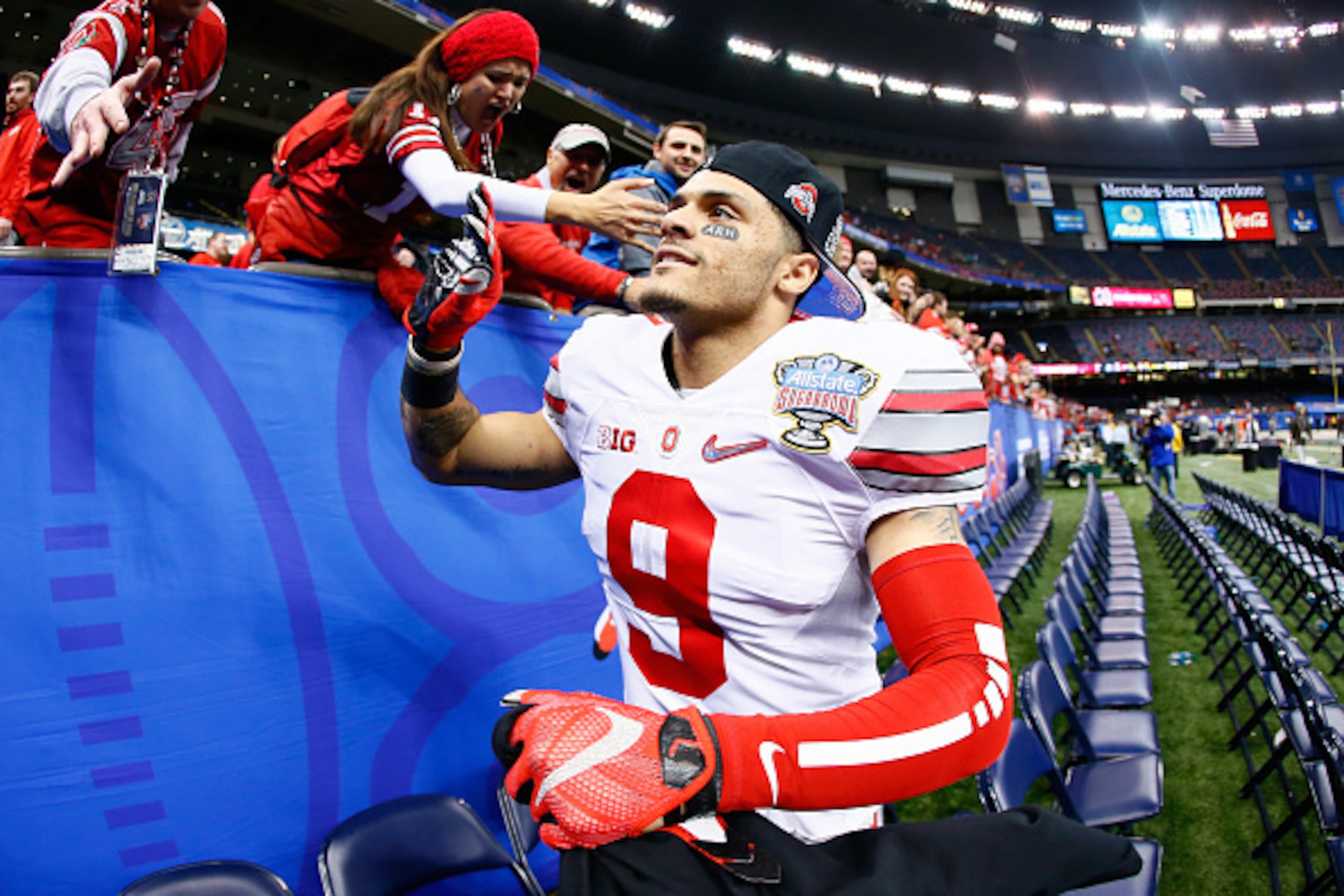 NEW ORLEANS, LA - JANUARY 01: Devin Smith #9 of the Ohio State Buckeyes celebrate after defeating the Alabama Crimson Tide 42-35 during the All State Sugar Bowl at the Mercedes-Benz Superdome on January 1, 2015 in New Orleans, Louisiana. (Photo by Kevin NEW ORLEANS, LA - JANUARY 01: Devin Smith #9 of the Ohio State Buckeyes celebrate after defeating the Alabama Crimson Tide 42-35 during the All State Sugar Bowl at the Mercedes-Benz Superdome on January 1, 2015 in New Orleans, Louisiana. (Photo by Kevin