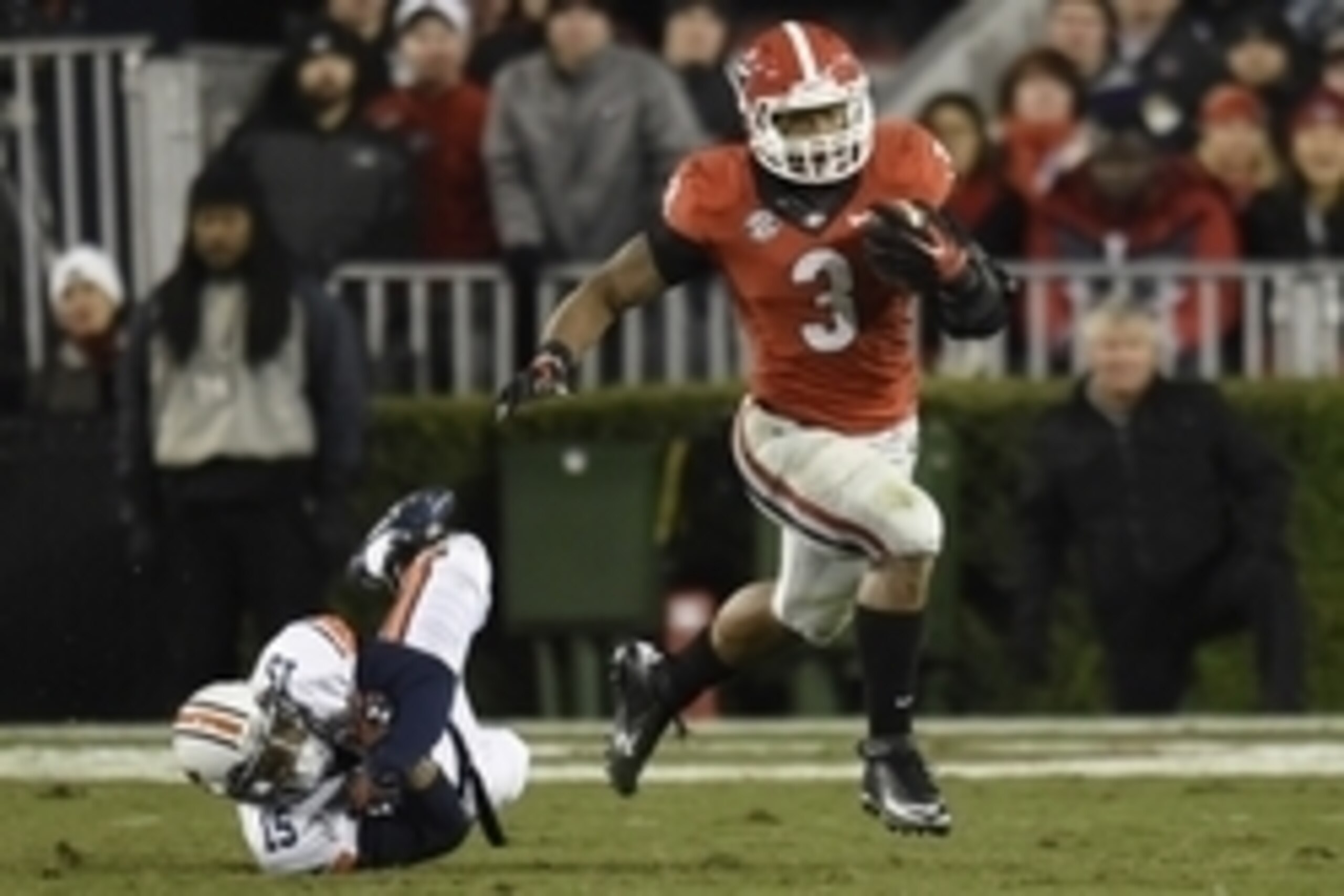 Nov 15, 2014; Athens, GA, USA; Georgia Bulldogs running back Todd Gurley (3) breaks a tackle by Auburn Tigers defensive back Joshua Holsey (15) during the second half at Sanford Stadium. Georgia defeated Auburn 34-7. Mandatory Credit: Dale Zanine-USA TODA