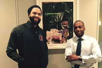 Gardy St. Fleur with Deron Williams in his NYC apartment next to a piece by artist Nathaniel M. Quinn called "Batman."