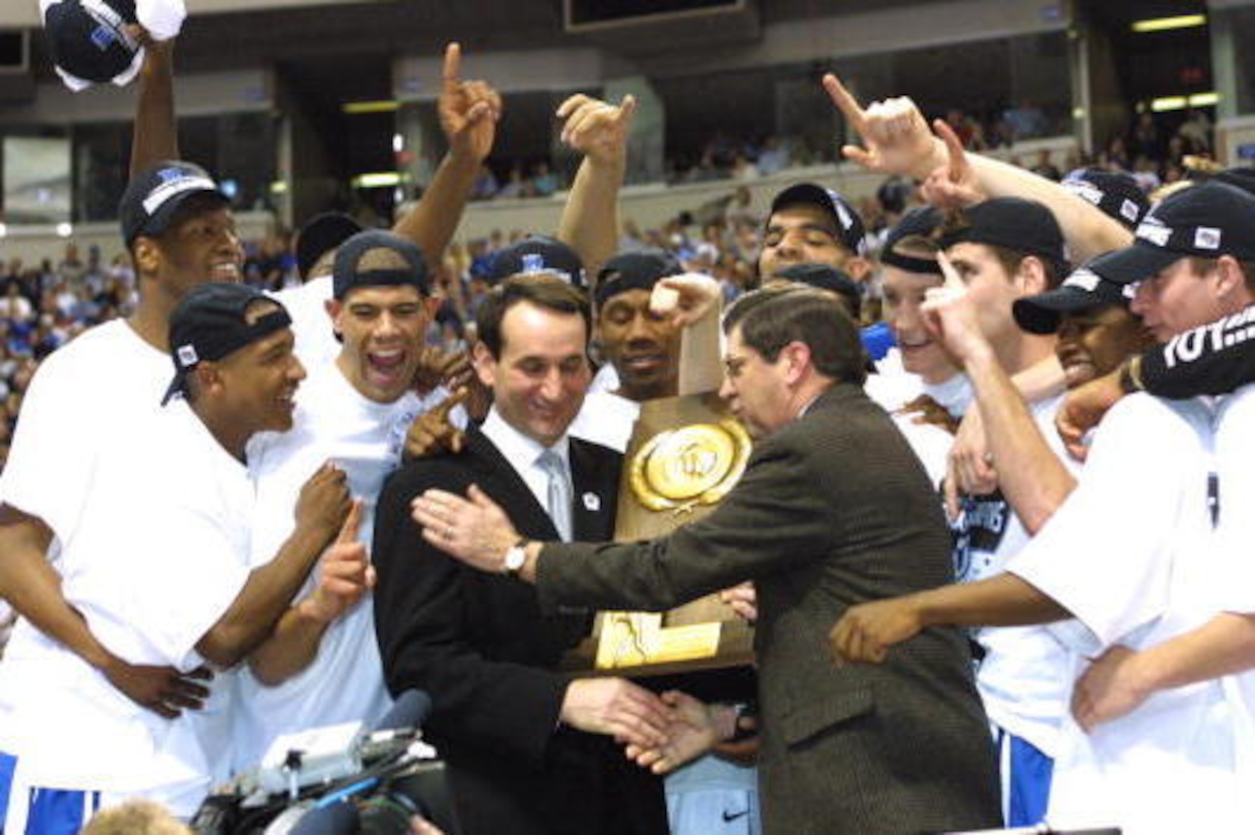 2 Apr 2001:  Head coach Mike Krzyzewski of Duke is presented with the trophy after defeating Arizona 82-72 in the NCAA National Championship Game of the Men's Final Four tournament at the Metrodome in Minneapolis, Minnesota.  DIGITAL IMAGE. Mandatory Cred