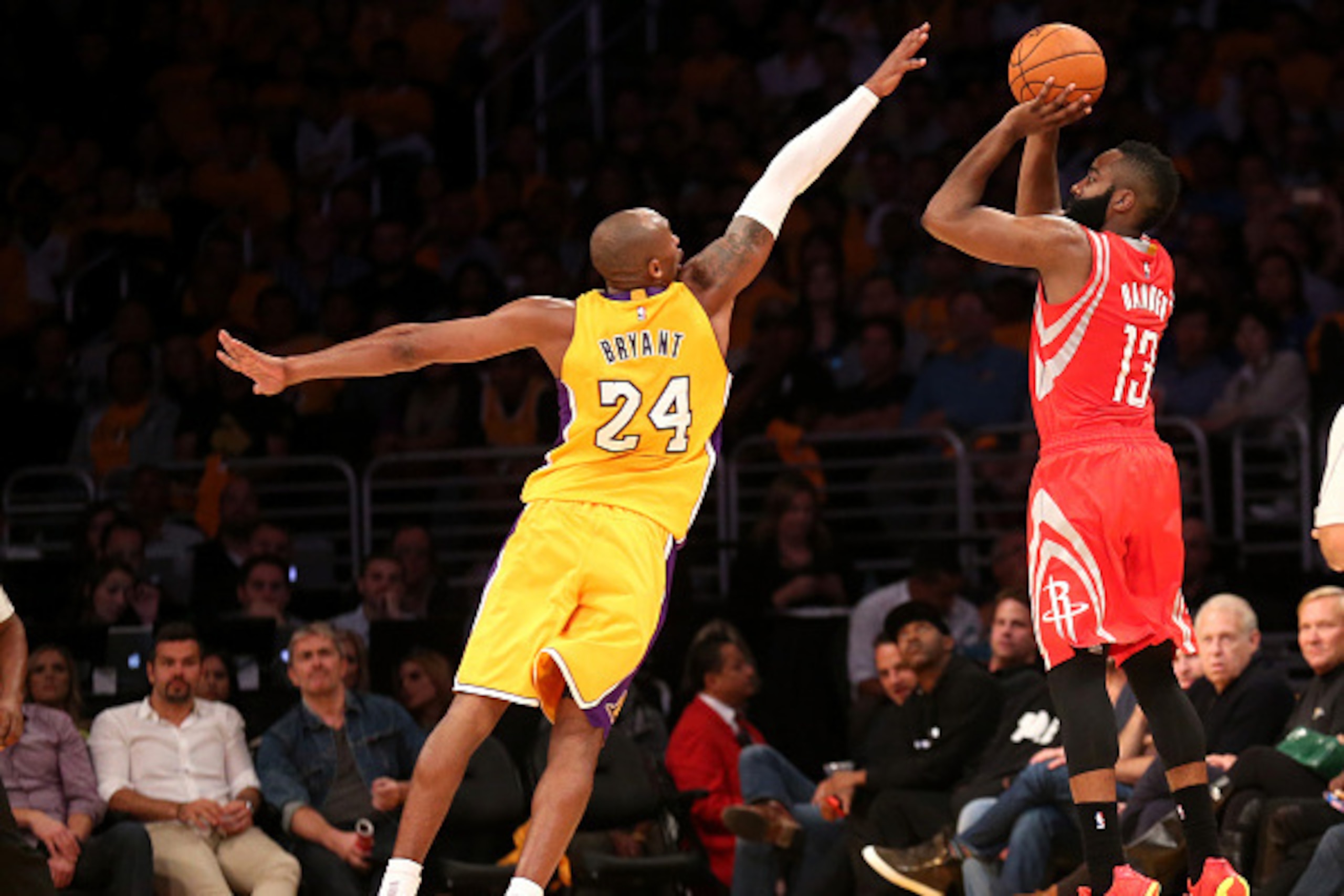 LOS ANGELES, CA - OCTOBER 28: James Harden #13 of the Houston Rockets shoots over Kobe Bryant #24 of the Los Angeles Lakers at Staples Center on October 28, 2014 in Los Angeles, California.  NOTE TO USER: User expressly acknowledges and agrees that, by do