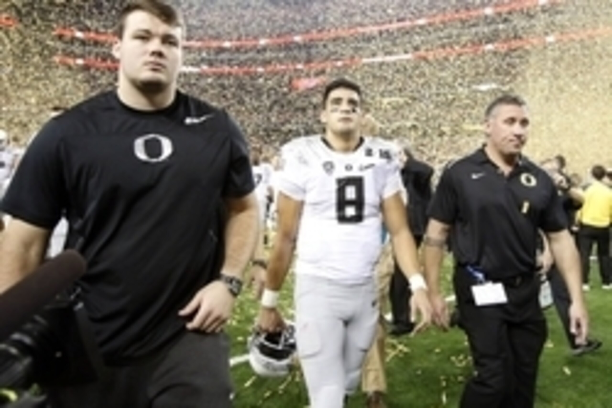 Jan 12, 2015; Arlington, TX, USA; Oregon Ducks quarterback Marcus Mariota (8) walks off the field after losing to the Ohio State Buckeyes in the 2015 CFP National Championship Game at AT&T Stadium. Mandatory Credit: Tim Heitman-USA TODAY Sports