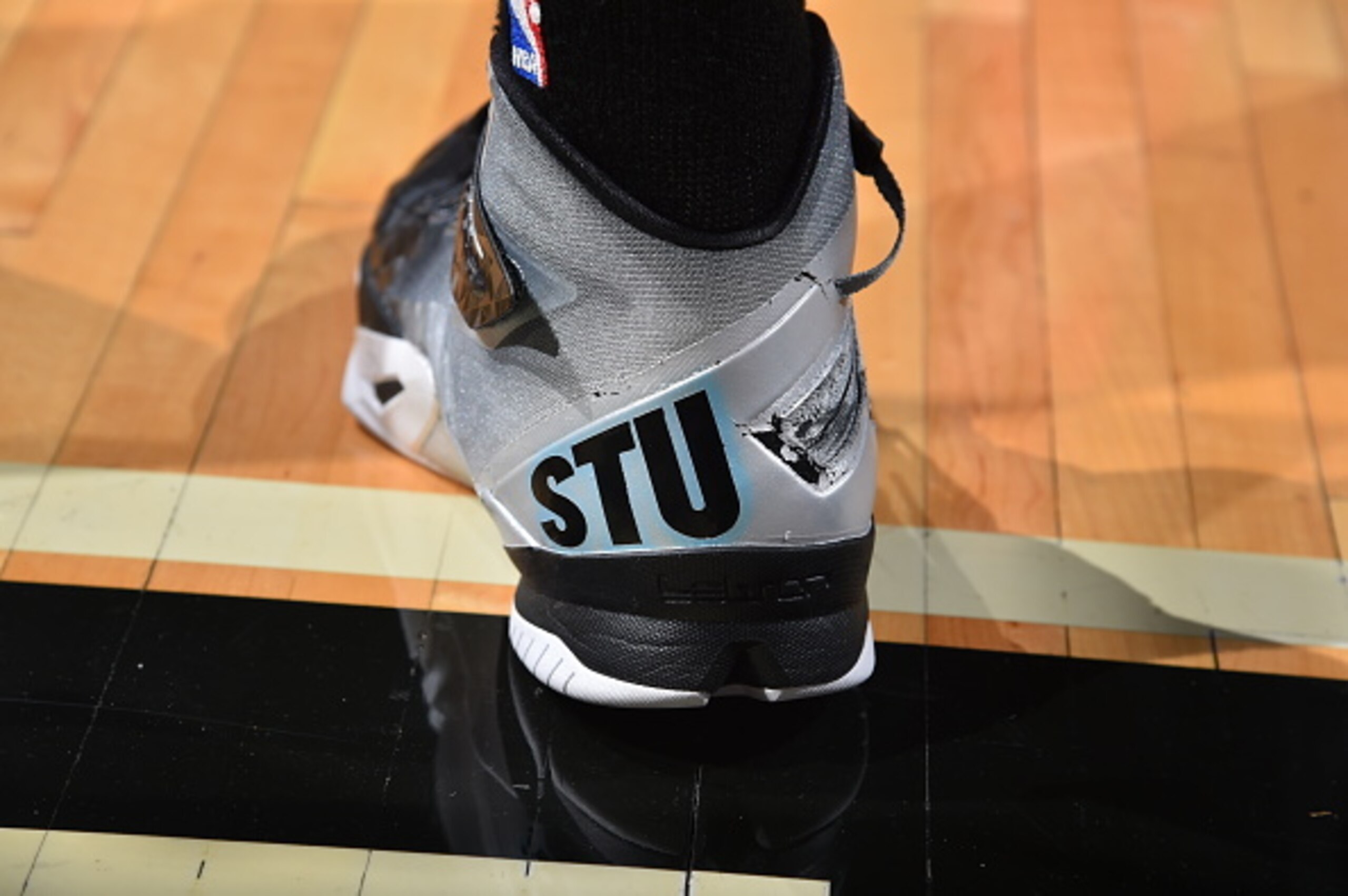 CHICAGO,IL - JANUARY 22: Danny Green #14 of the San Antonio Spurs honors Stewart Scott with custom sneakers with Stewarts catch phrases on them prior to the game against the Chicago Bulls at the United Center on January 21, 2015 in Chicago, Illinois . NOT