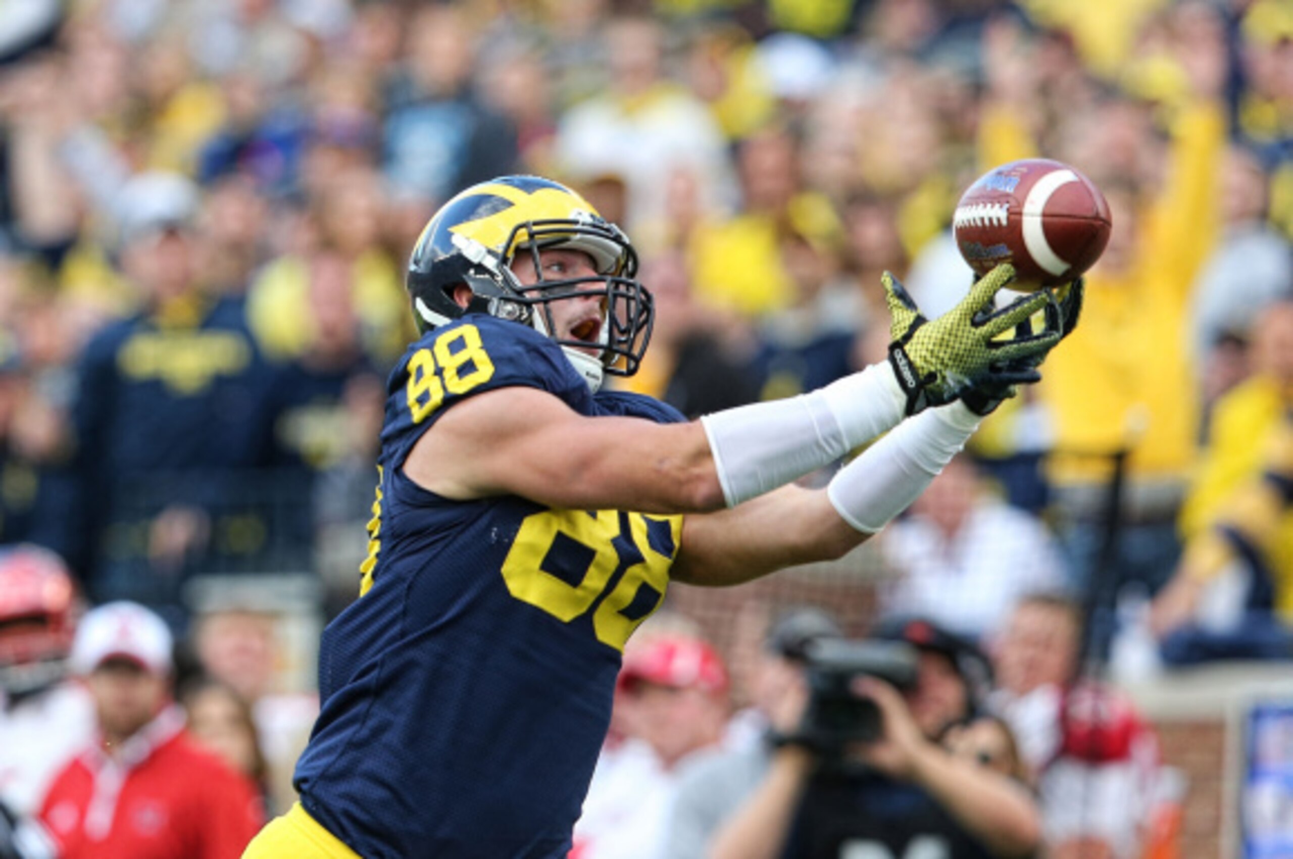 ANN ARBOR, MI - SEPTEMBER 13:  Jake Butt #88 of the Michigan Wolverines catches a 29 yard pass for a third quarter touchdown during the game against the Miami University Redhawks at Michigan Stadium on September 13, 2014 in Ann Arbor, Michigan. the Wolver