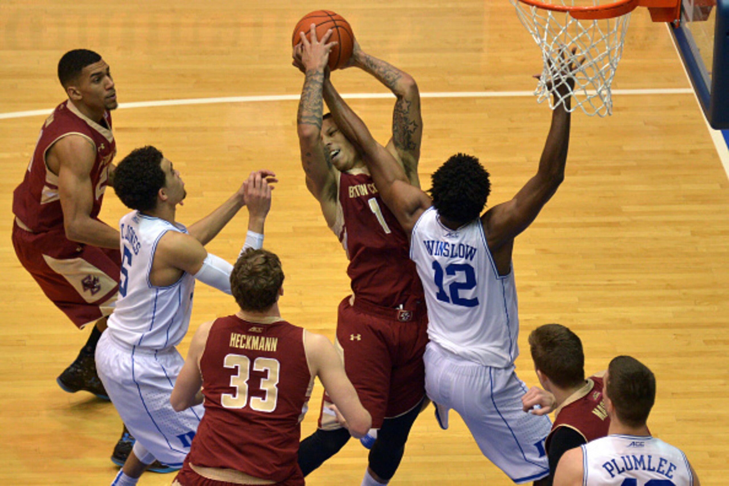 DURHAM, NC - JANUARY 03: Justise Winslow #12 of the Duke Blue Devils defends Dimitri Batten #1 of the Boston College Eagles during their game at Cameron Indoor Stadium on January 3, 2015 in Durham, North Carolina. Duke defeated Boston College 85-62. (Phot