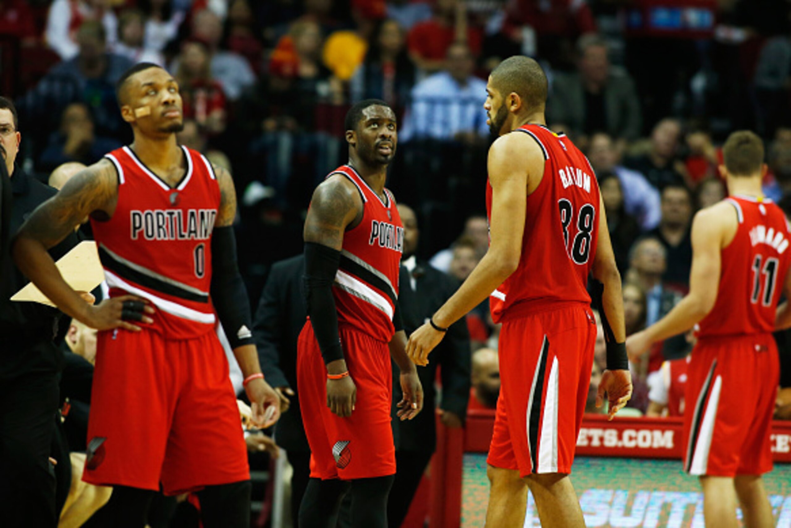 HOUSTON, TX - DECEMBER 22:  (L-R) Damian Lillard, Wesley Matthews, Nicolas Batum and Meyers Leonard of the Portland Trail Blazers wait on the court as a play is reviewed during their game against the Houston Rockets at the Toyota Center on December 22, 20