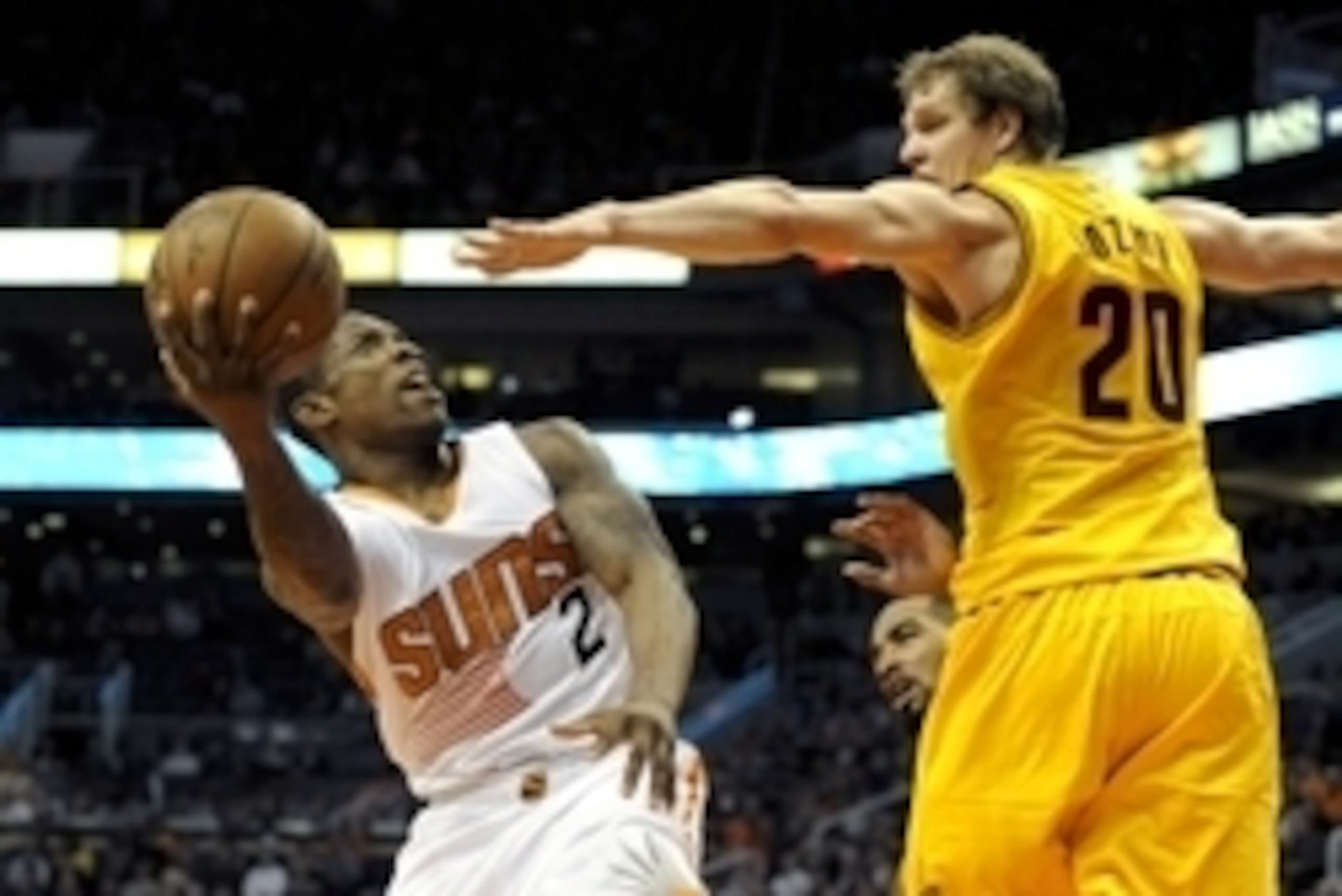 Jan 13, 2015; Phoenix, AZ, USA; Phoenix Suns guard Eric Bledsoe (2) shoots as he is defended by Cleveland Cavaliers center Timofey Mozgov (20) during the third quarter at US Airways Center. Phoenix won 107-100. Mandatory Credit: Casey Sapio-USA TODAY Spor