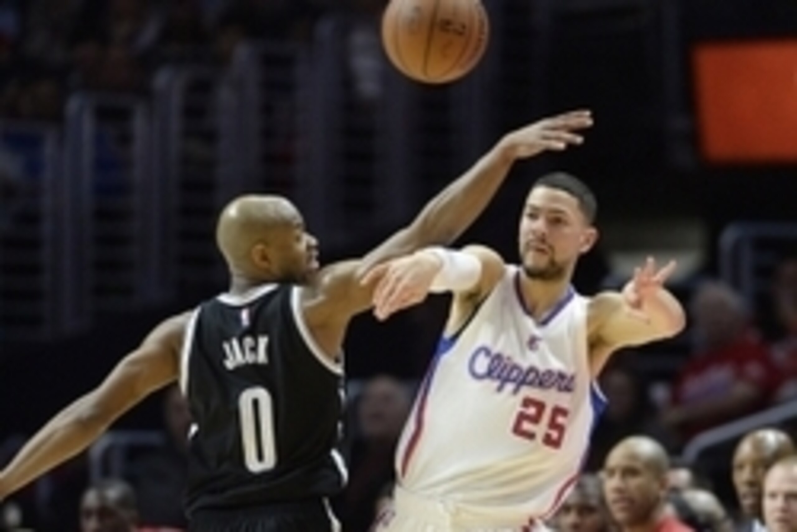Jan 22, 2015; Los Angeles, CA, USA; Los Angeles Clippers guard Austin Rivers (25) passes the ball away from Brooklyn Nets guard Jarrett Jack (0) during the first half at Staples Center. Mandatory Credit: Richard Mackson-USA TODAY Sports
