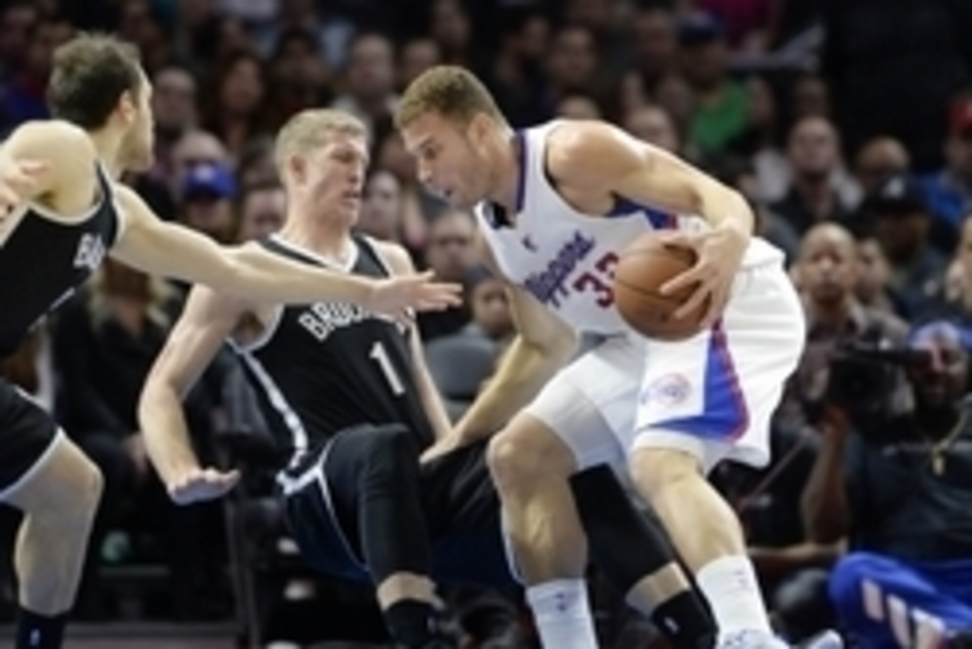 Jan 22, 2015; Los Angeles, CA, USA; Los Angeles Clippers forward Blake Griffin (32) posts up against Brooklyn Nets center Mason Plumlee (1) during the first half at Staples Center. Mandatory Credit: Richard Mackson-USA TODAY Sports