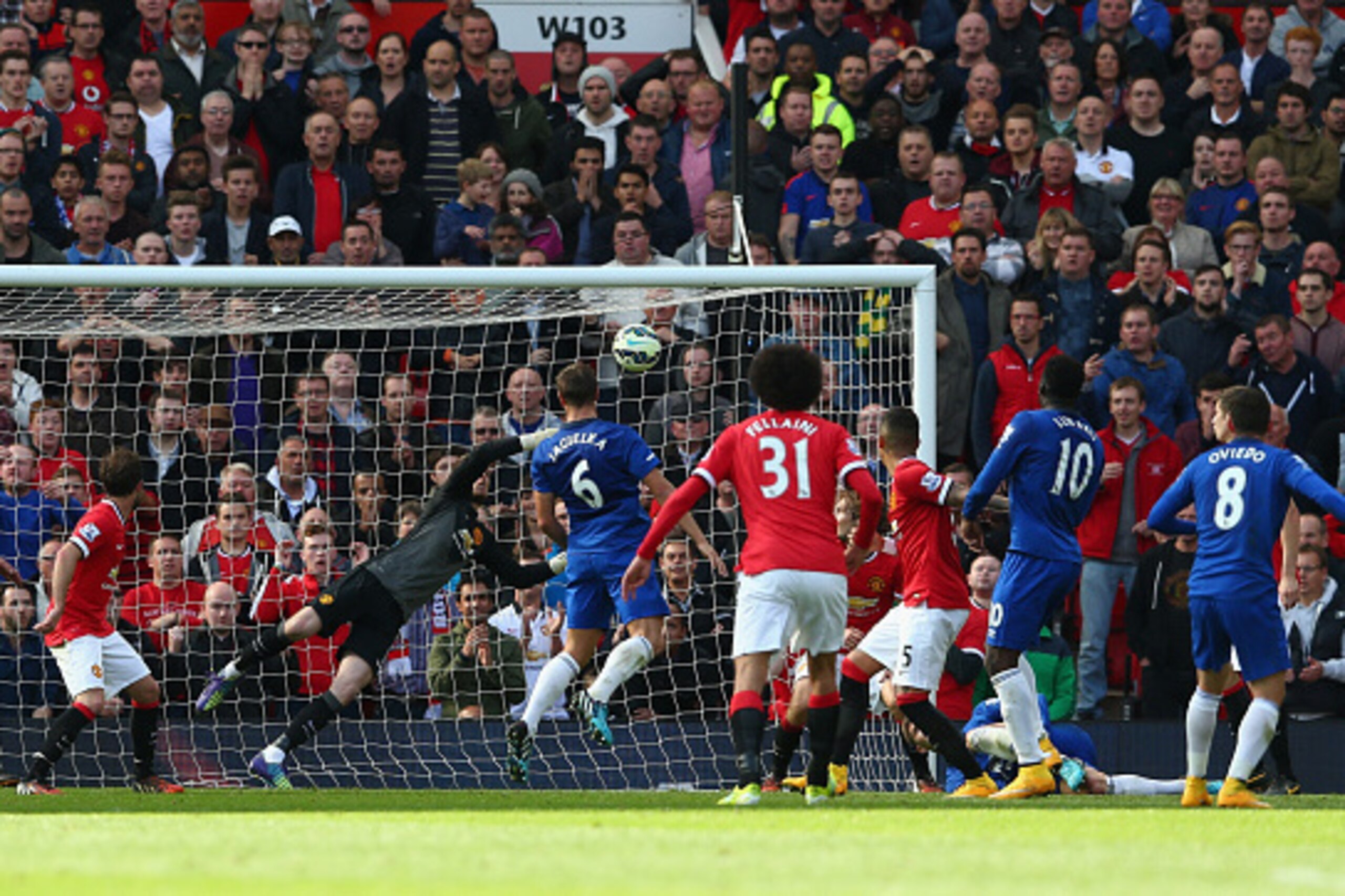 MANCHESTER, ENGLAND - OCTOBER 05:  David De Gea of Manchester United saves the shot of Bryan Oviedo of Everton during the Barclays Premier League match between Manchester United and Everton at Old Trafford on October 5, 2014 in Manchester, England.  (Phot