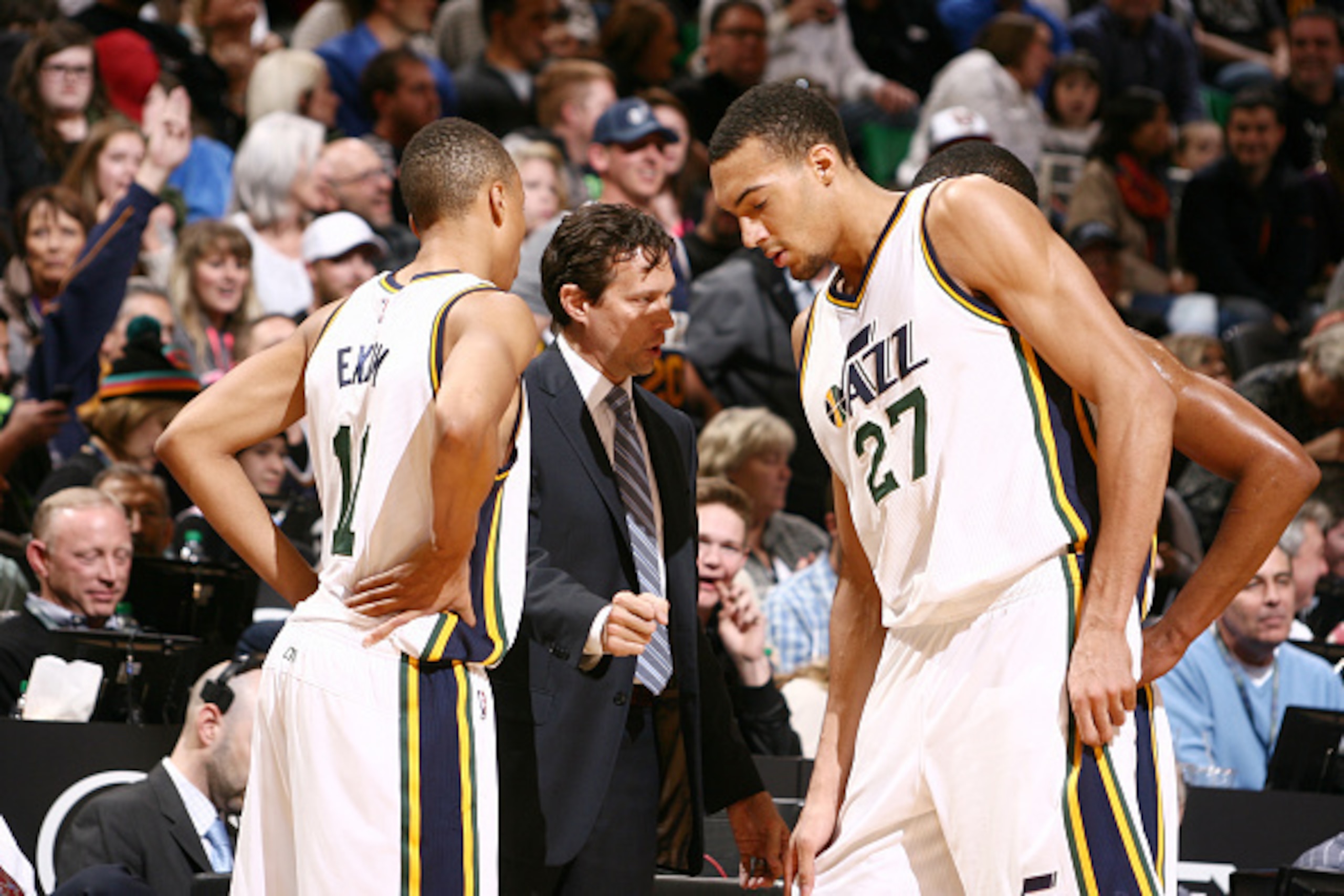 SALT LAKE CITY, UT - DECEMBER 09: Quin Snyder, head coach of the Utah Jazz talks to players Rudy Gobert #27 and Dante Exum #11 during break in play against the San Antonio Spurs at EnergySolutions Arena on December 09, 2014 in Salt Lake City, Utah. NOTE T