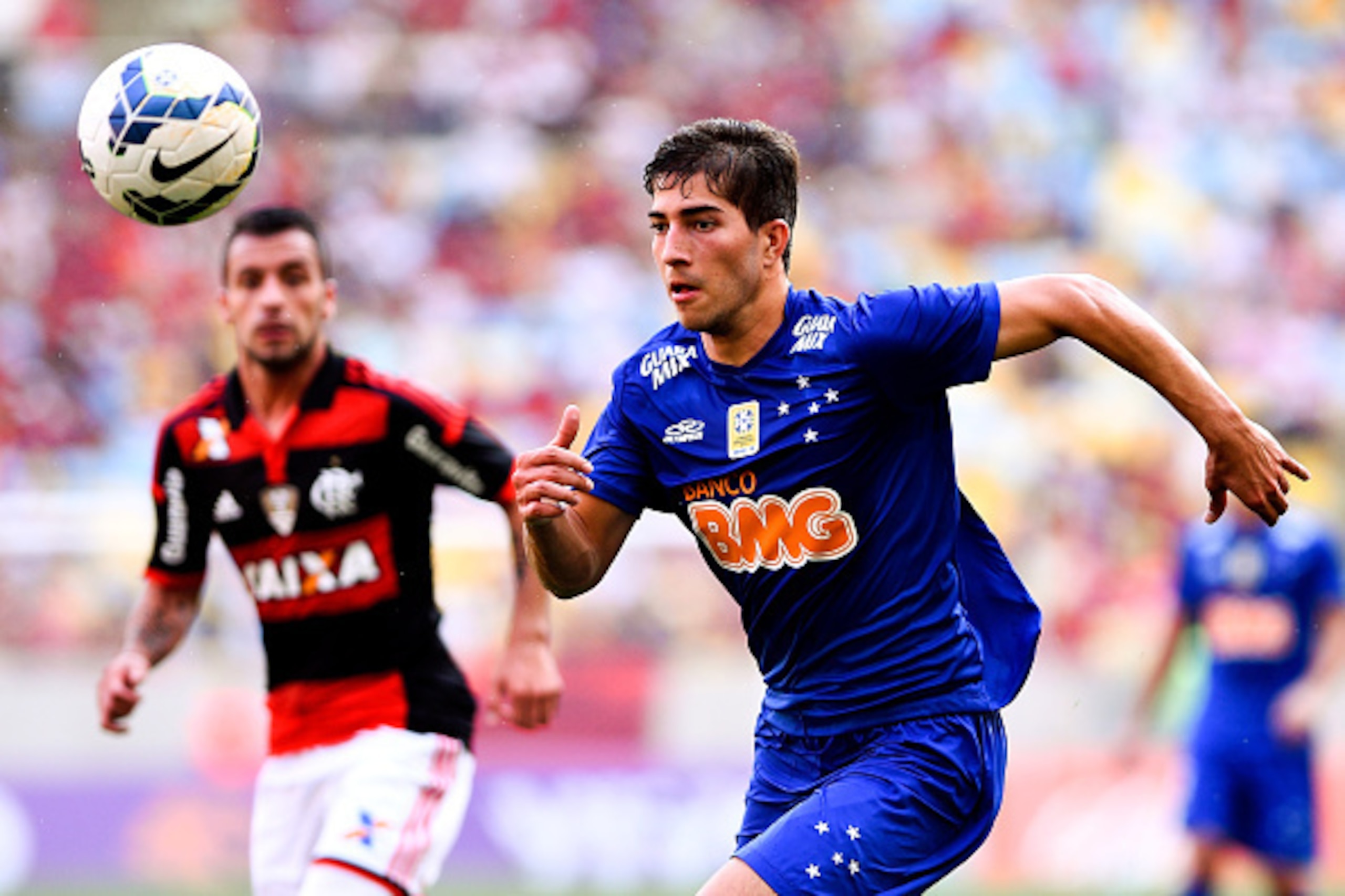 RIO DE JANEIRO, BRAZIL - OCTOBER 12:  Lucas Silva of Cruzeiro moves the ball against Canteros (L) of Flamengo during a match between Flamengo and Cruzeiro as part of Brasileirao Series A 2014 at Maracana Stadium on October 12, 2014 in Rio de Janeiro, Braz