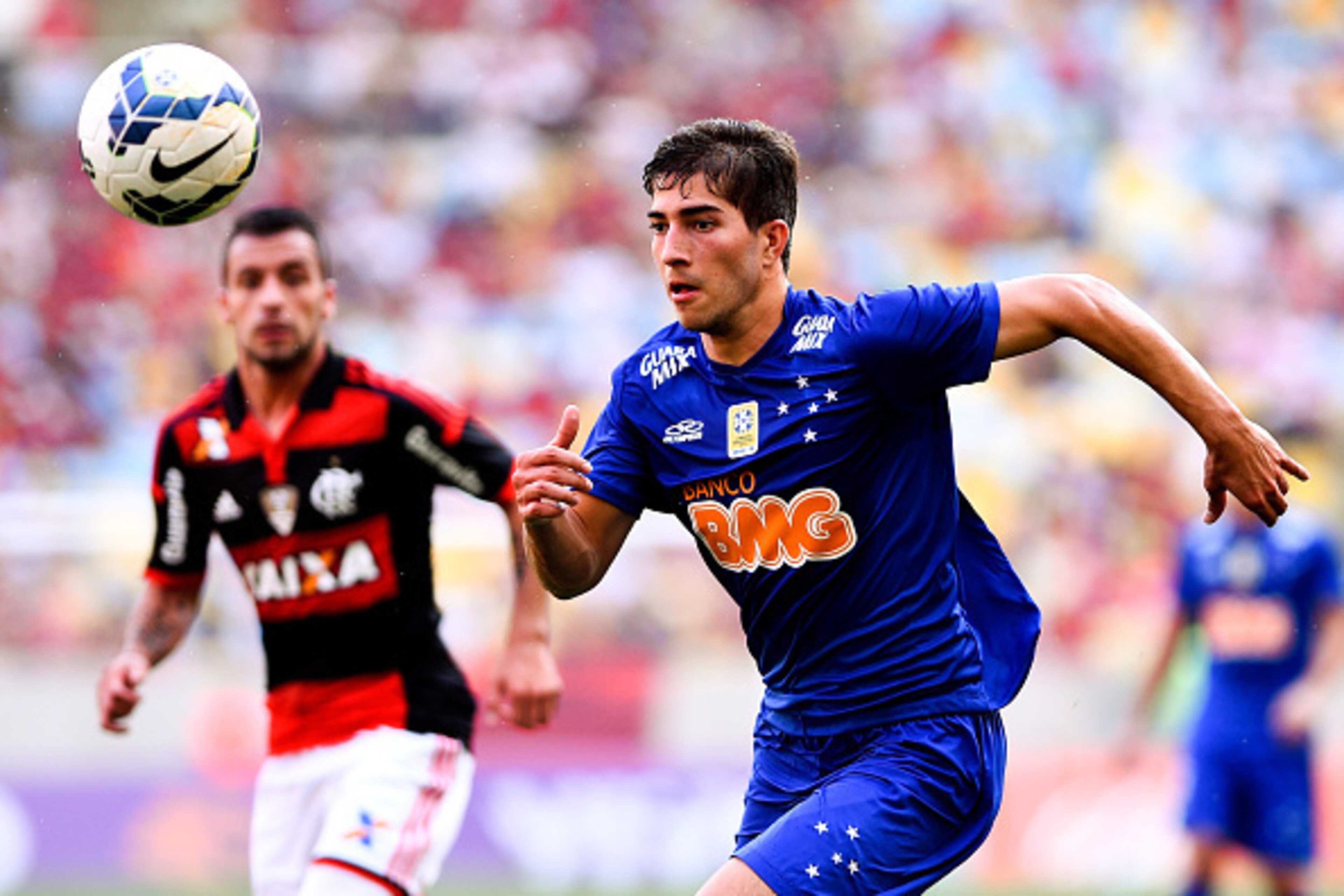 RIO DE JANEIRO, BRAZIL - OCTOBER 12:  Lucas Silva of Cruzeiro moves the ball against Canteros (L) of Flamengo during a match between Flamengo and Cruzeiro as part of Brasileirao Series A 2014 at Maracana Stadium on October 12, 2014 in Rio de Janeiro, Braz