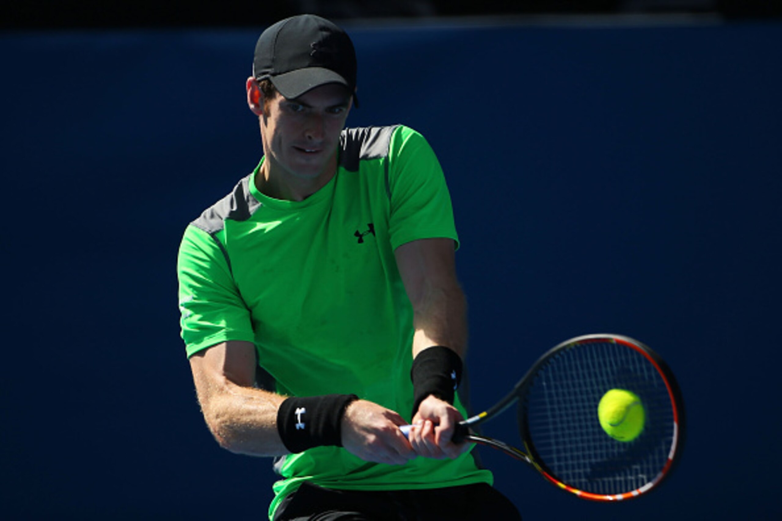 MELBOURNE, AUSTRALIA - JANUARY 23:  Andy Murray of Great Britain plays a backhand in his third round match against Joao Sousa of Portugal during day five of the 2015 Australian Open at Melbourne Park on January 23, 2015 in Melbourne, Australia.  (Photo by