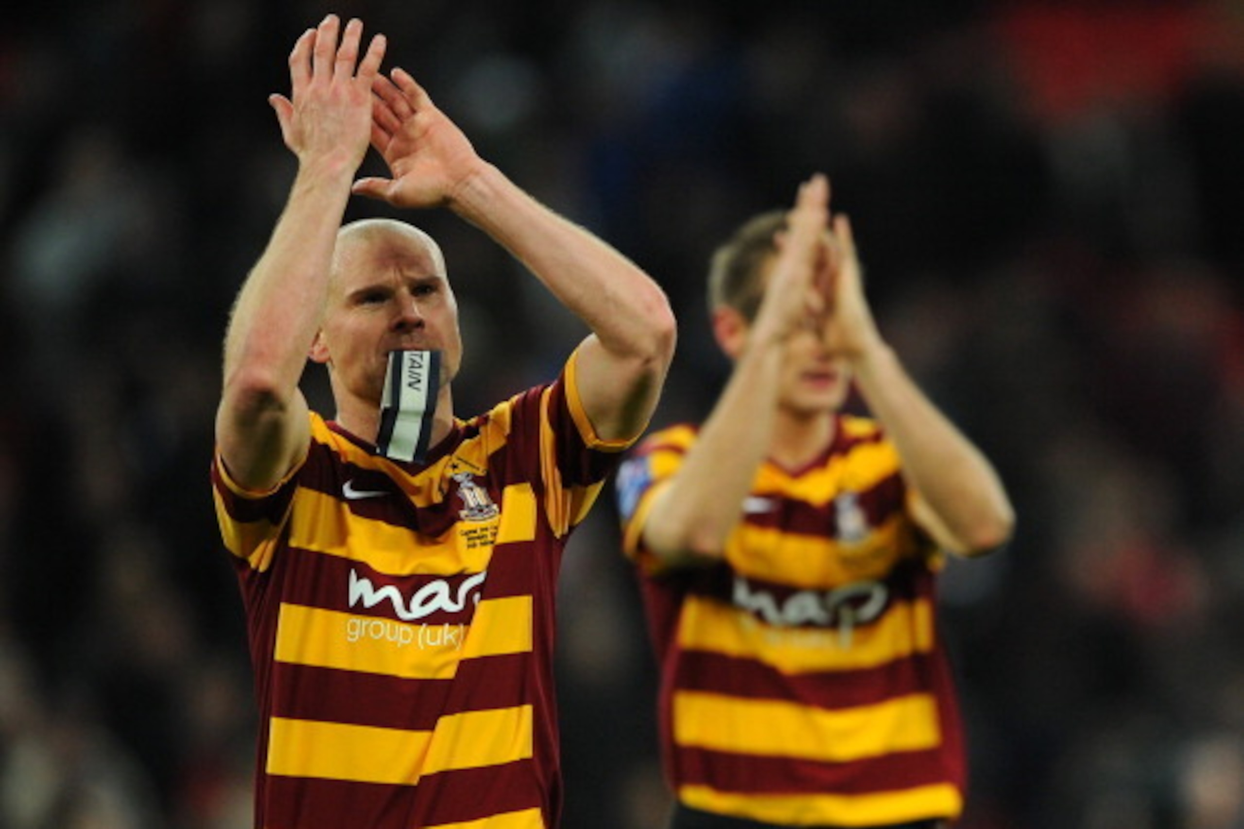 LONDON, ENGLAND - FEBRUARY 24: Captain Gary Jones of Bradford City applauds the fans at the final whistle during the Capital One Cup Final match between Bradford City and Swansea City at Wembley Stadium on February 24, 2013 in London, England. (Photo by LONDON, ENGLAND - FEBRUARY 24: Captain Gary Jones of Bradford City applauds the fans at the final whistle during the Capital One Cup Final match between Bradford City and Swansea City at Wembley Stadium on February 24, 2013 in London, England. (Photo by