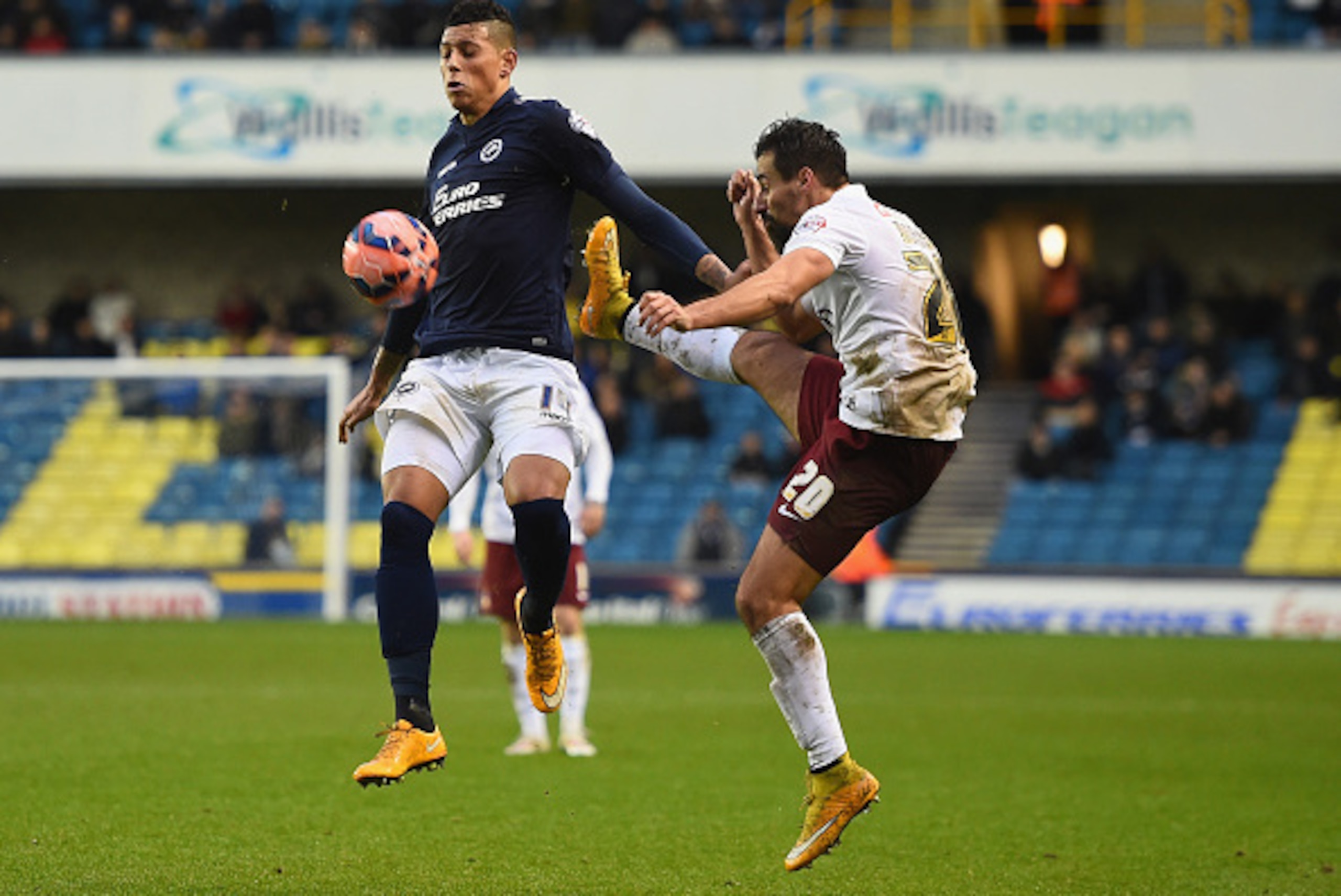 LONDON, ENGLAND - JANUARY 03: Matt Briggs of Millwall wins the ball in the air as Filipe Morais of Bradford tries to win it during the FA Cup Third Round match between Millwall and Bradford City at The Den on January 3, 2015 in London, England. (Photo b LONDON, ENGLAND - JANUARY 03: Matt Briggs of Millwall wins the ball in the air as Filipe Morais of Bradford tries to win it during the FA Cup Third Round match between Millwall and Bradford City at The Den on January 3, 2015 in London, England. (Photo b