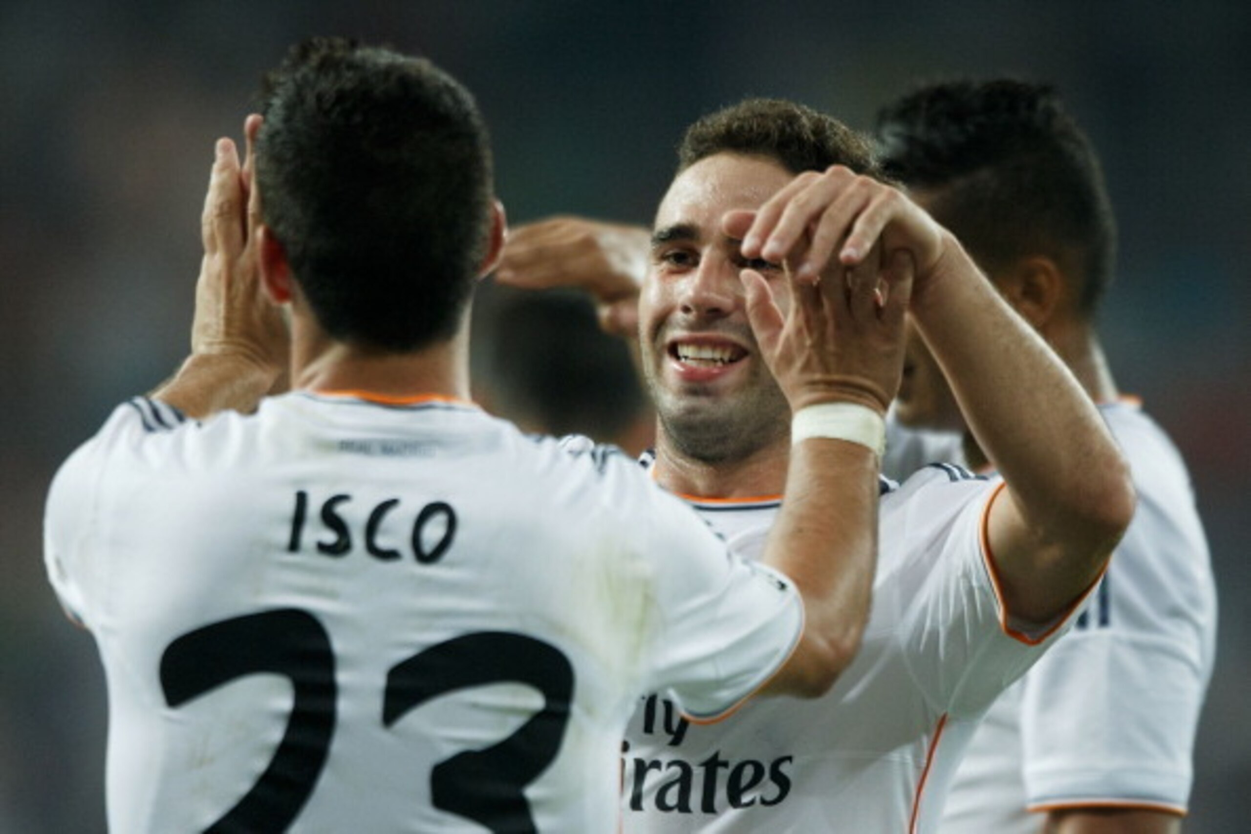 MADRID, SPAIN - AUGUST 18:  Francisco Roman Alarcon alias Isco of Real Madrid CF celebrates scoring their second goal with Daniel Carvajal during the La Liga match between Real Madrid CF and Real Betis Balompie at Estadio Santiago Bernabeu on August 18, 2
