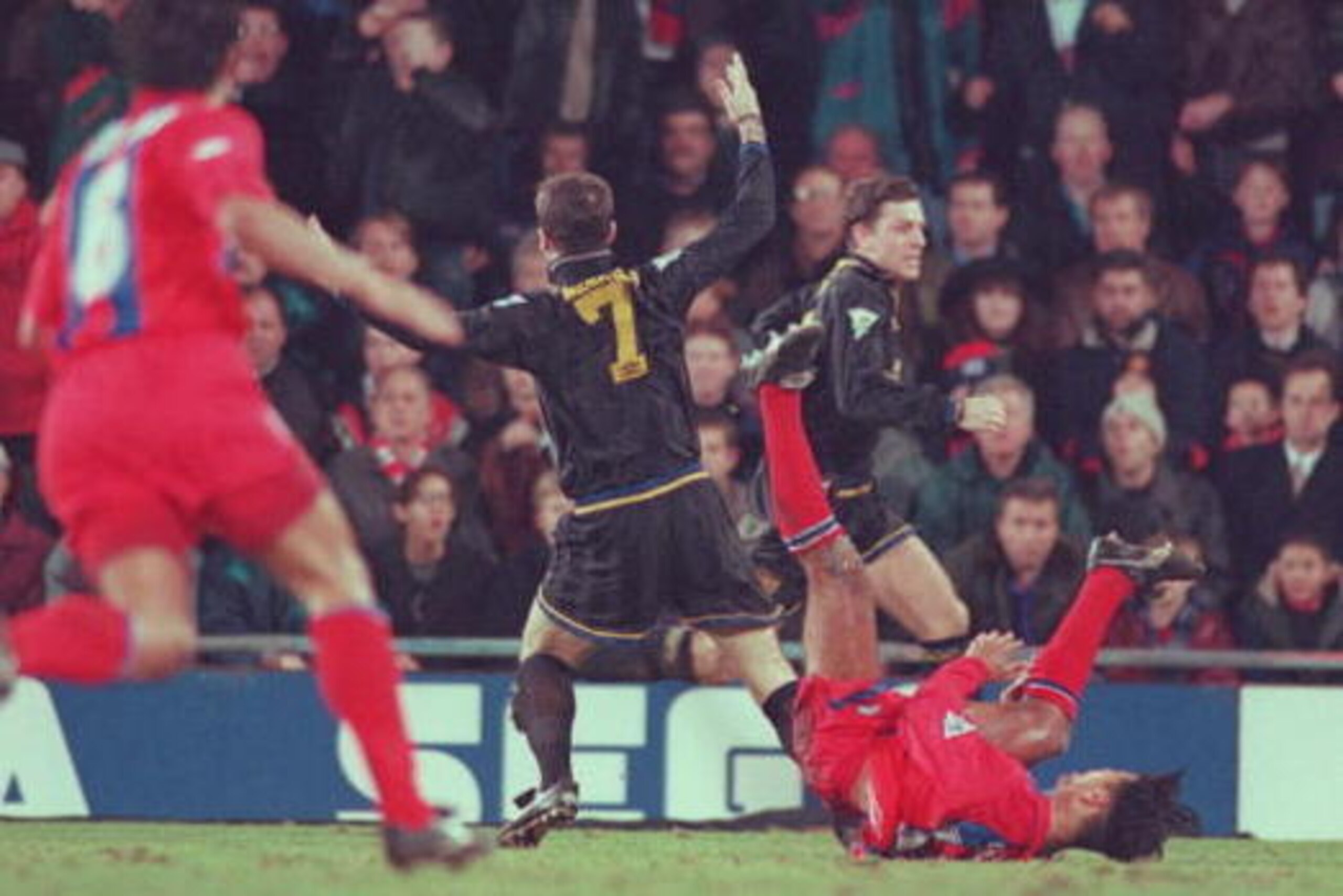 25 JAN 1995:  ERIC CANTONA OF MANCHESTER UNITED IS INVOLVED IN A FIGHT WITH A FAN AFTER HE WAS SENT OFF DURING THE CRYSTAL PALACE V MANCHESTER UNITED MATCH AT SELHURST PARK. Mandatory Credit: Shaun Botterill/ALLSPORT