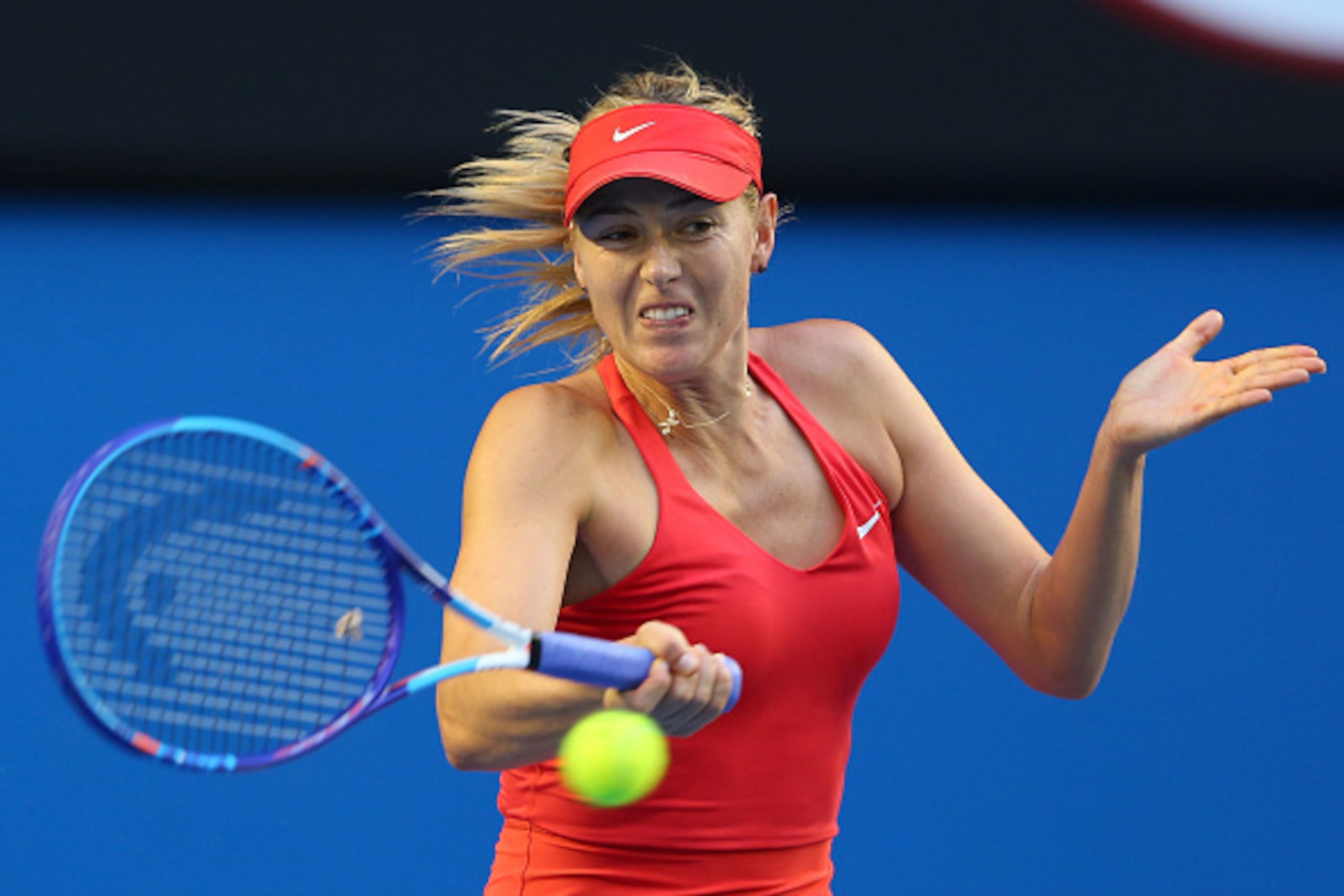MELBOURNE, AUSTRALIA - JANUARY 23:  Maria Sharapova of Russia plays a forehand in her third round match against Zarina Diyas of Kazakhstan during day five of the 2015 Australian Open at Melbourne Park on January 23, 2015 in Melbourne, Australia.  (Photo b