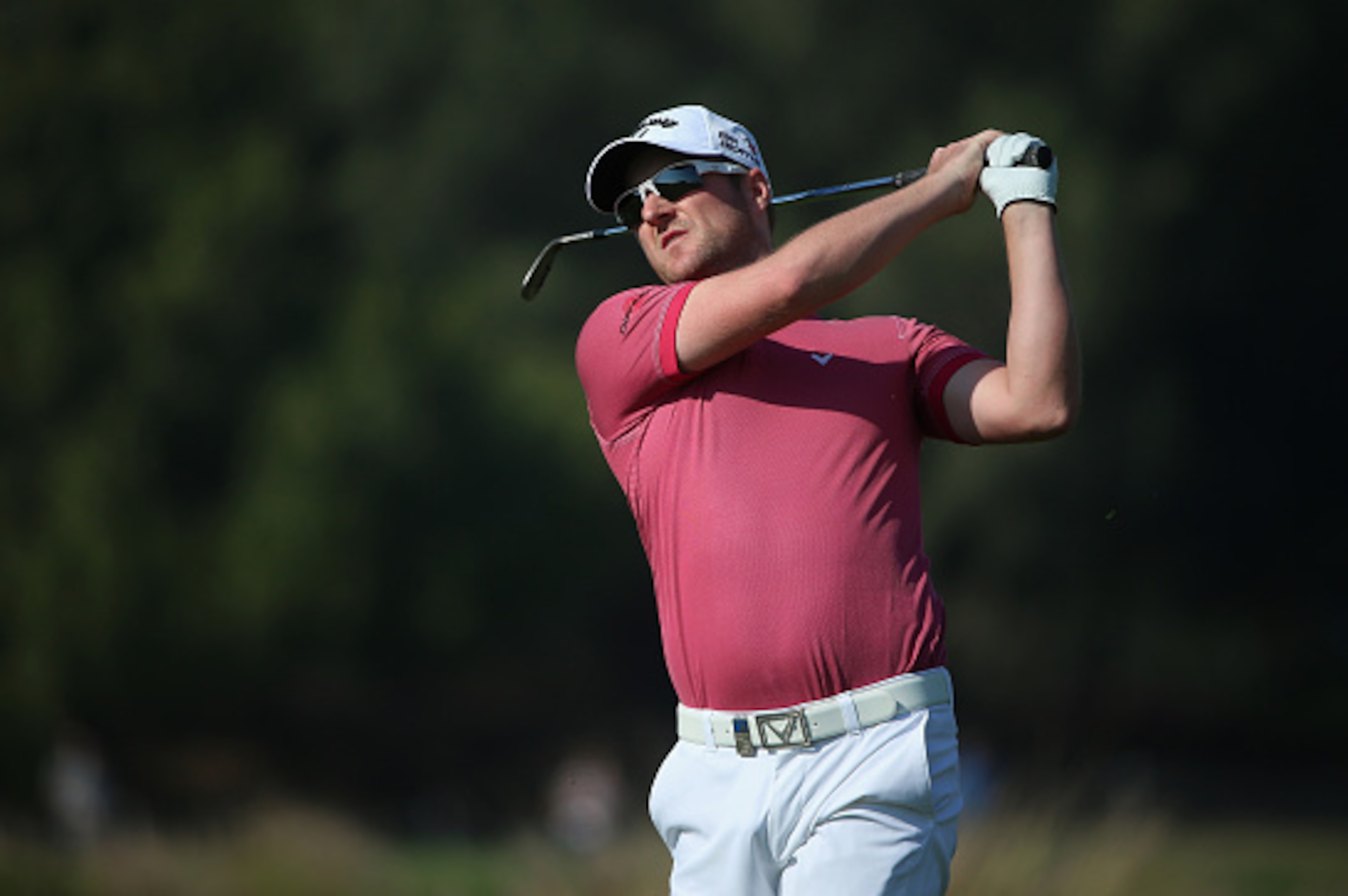 DOHA, QATAR - JANUARY 23:  Marc Warren of Scotland plays his third shot on the ninth hole during the third round of the Commercial Bank Qatar Masters at Doha Golf Club on January 23, 2015 in Doha, Qatar.  (Photo by Andrew Redington/Getty Images)