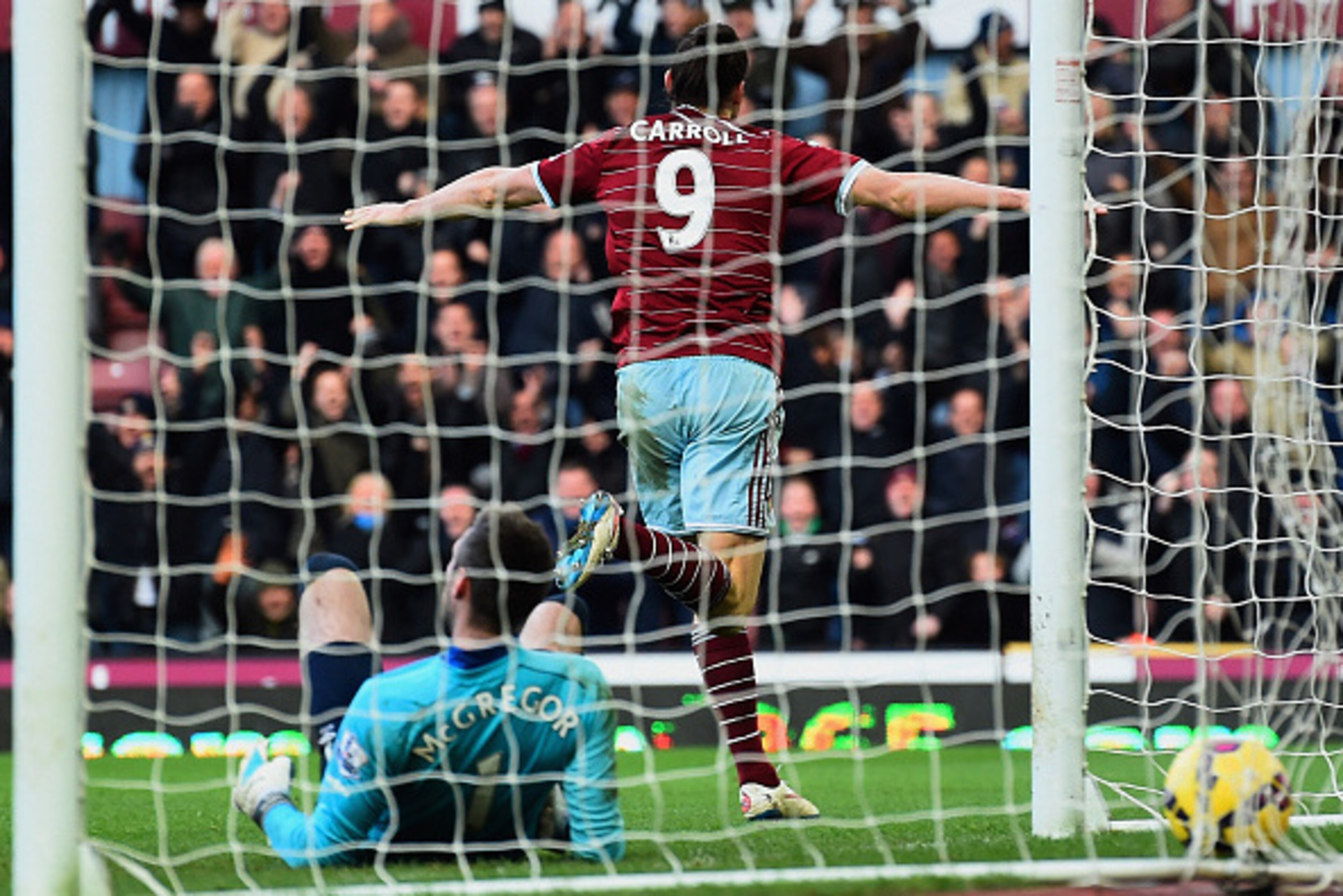 LONDON, ENGLAND - JANUARY 18:  Despair for goalkeeper Allan McGregor of Hull City as Andy Carroll of West Ham United celebrates scoring their first goal during the Barclays Premier League match between West Ham United and Hull City at Boleyn Ground on Jan