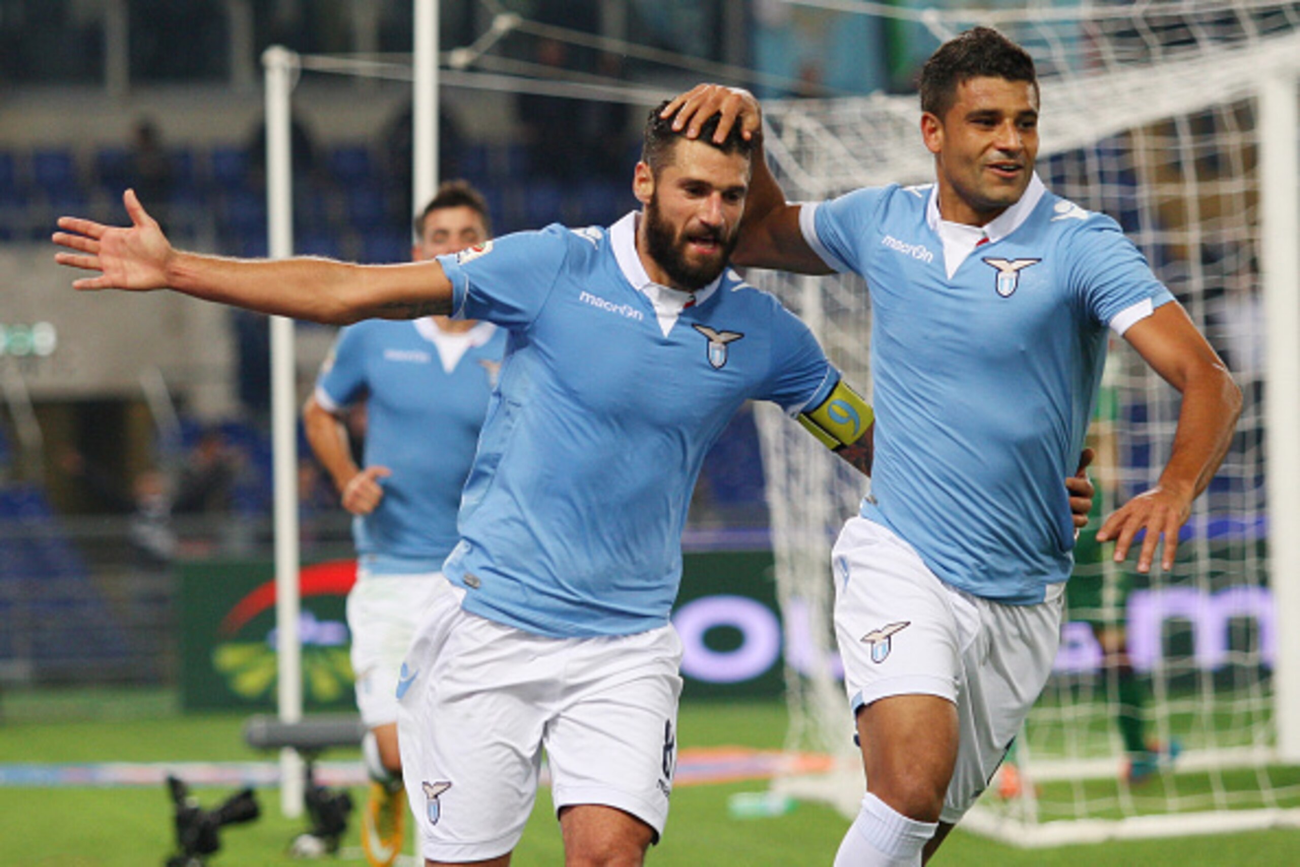 ROME, ITALY - NOVEMBER 03:  Honorato Ederson (R) with his teammate Antonio Candreva of SS Lazio celebrates after scoring the fourth team's goal during the Serie A match between SS Lazio and Cagliari Calcio at Stadio Olimpico on November 3, 2014 in Rome, I