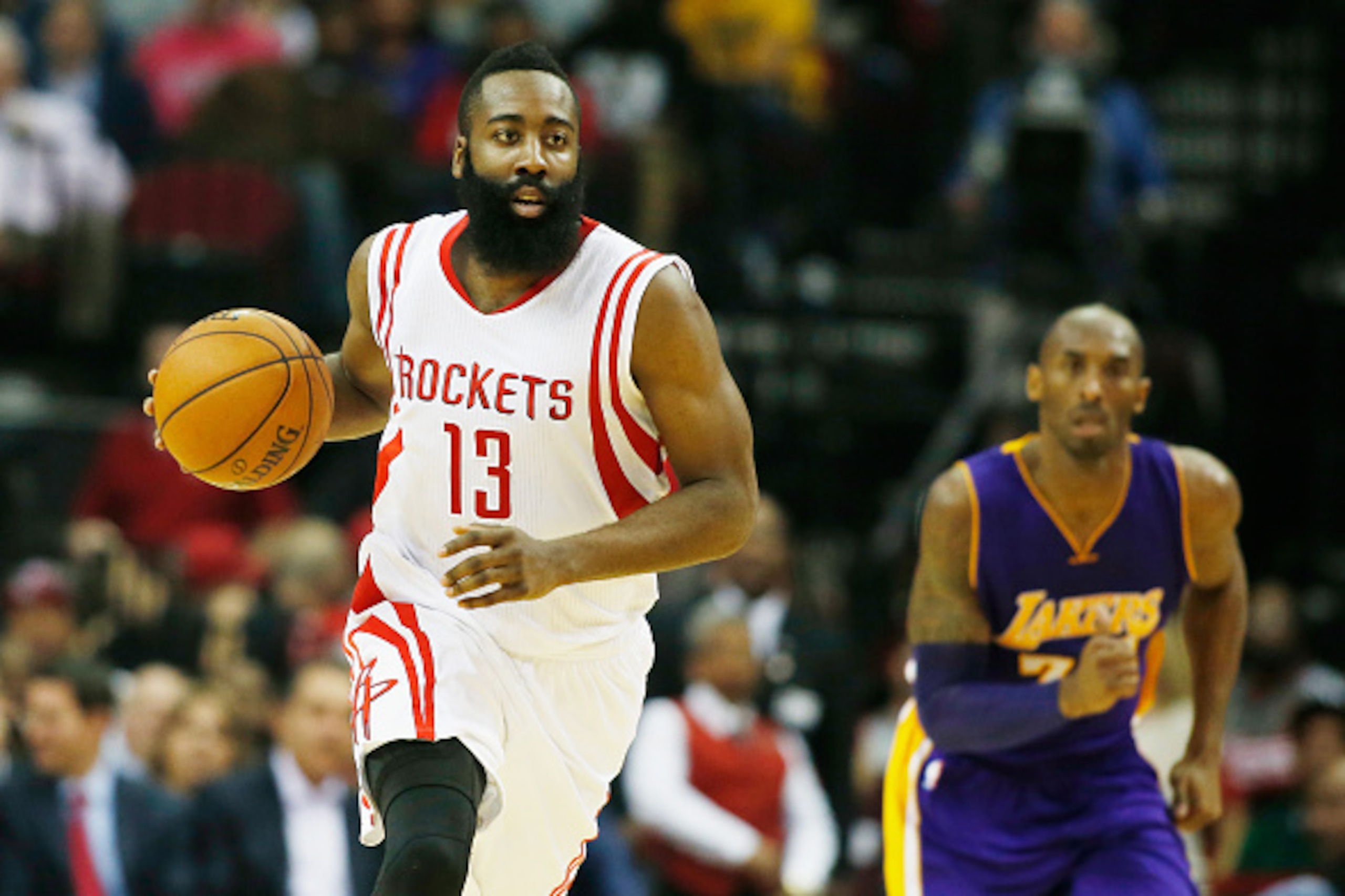 HOUSTON, TX - NOVEMBER 19: James Harden #13 of the Houston Rockets takes the ball upcourt in front of Kobe Bryant #24 of the Los Angeles Lakers during their game at the Toyota Center on November 19, 2014 in Houston, Texas. NOTE TO USER: User expressly a HOUSTON, TX - NOVEMBER 19: James Harden #13 of the Houston Rockets takes the ball upcourt in front of Kobe Bryant #24 of the Los Angeles Lakers during their game at the Toyota Center on November 19, 2014 in Houston, Texas. NOTE TO USER: User expressly a