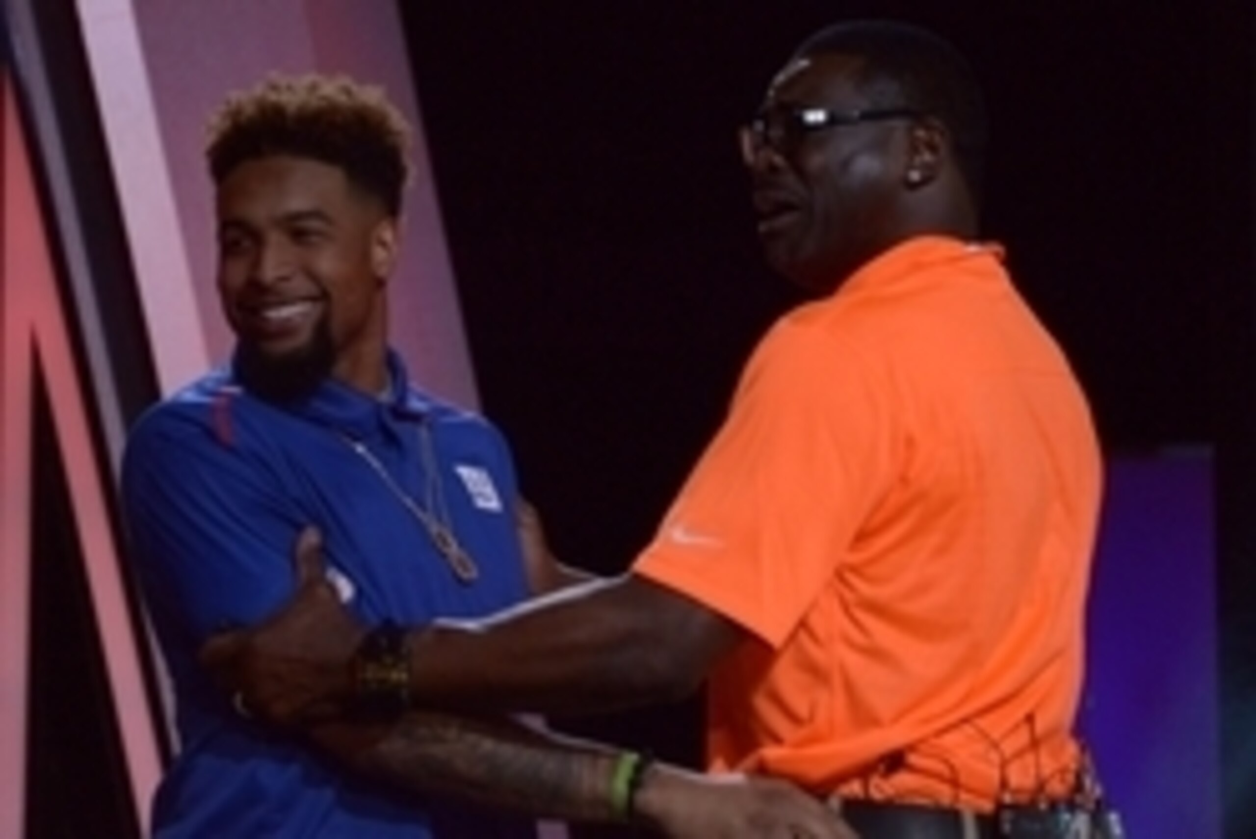 Jan 21, 2015; Phoenix, AZ, USA; New York Giants receiver Odell Beckham (L) shakes hands with Michael Irvin (R) during the 2015 Pro Bowl Draft at The Arizona Biltmore. Mandatory Credit: Kirby Lee-USA TODAY Sports