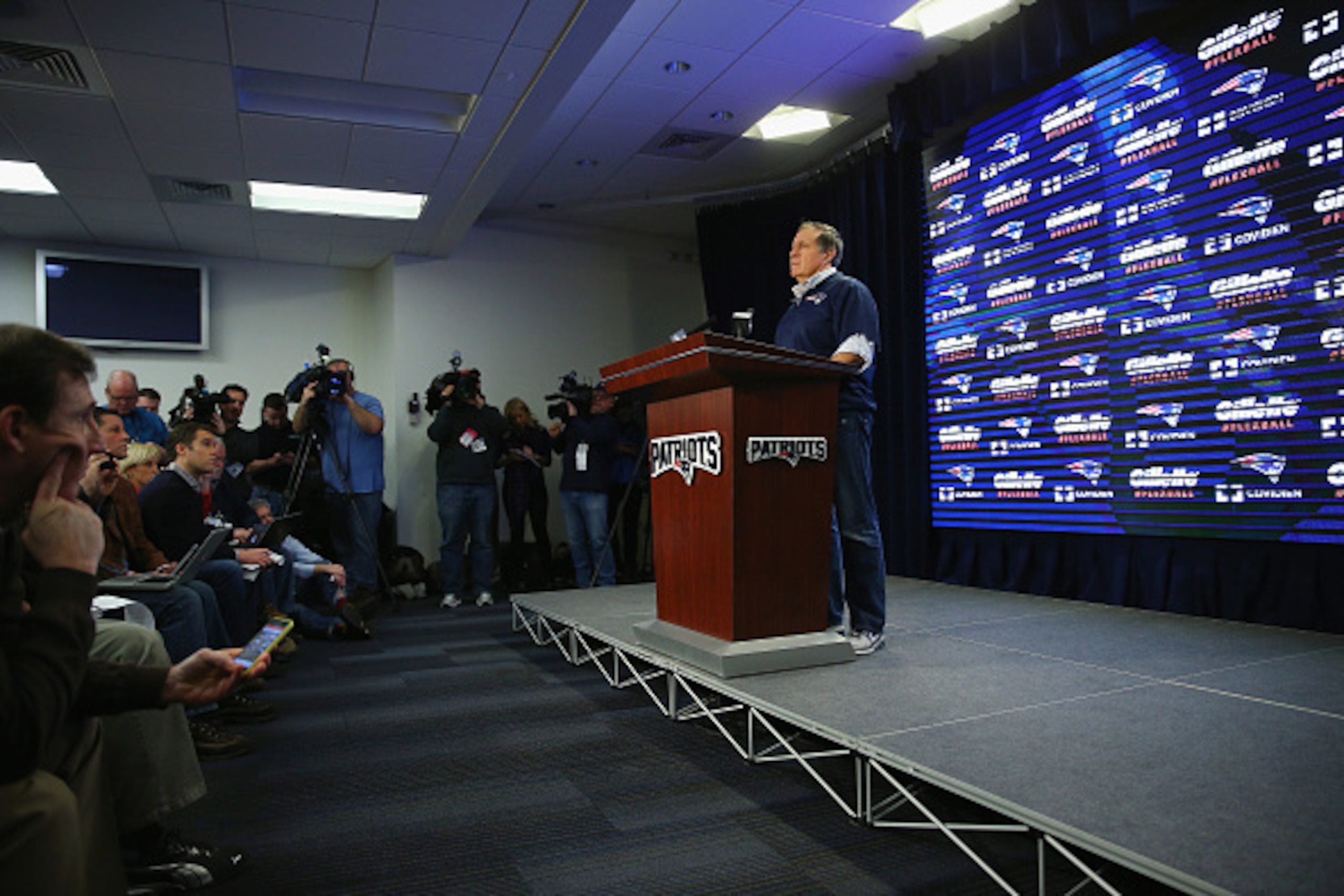 FOXBORO, MA - JANUARY 22:  New England Patriots head coach Bill Belichick talks to the media during a press conference to address the under inflation of footballs used in the AFC championship game at Gillette Stadium on January 22, 2015 in Foxboro, Massac
